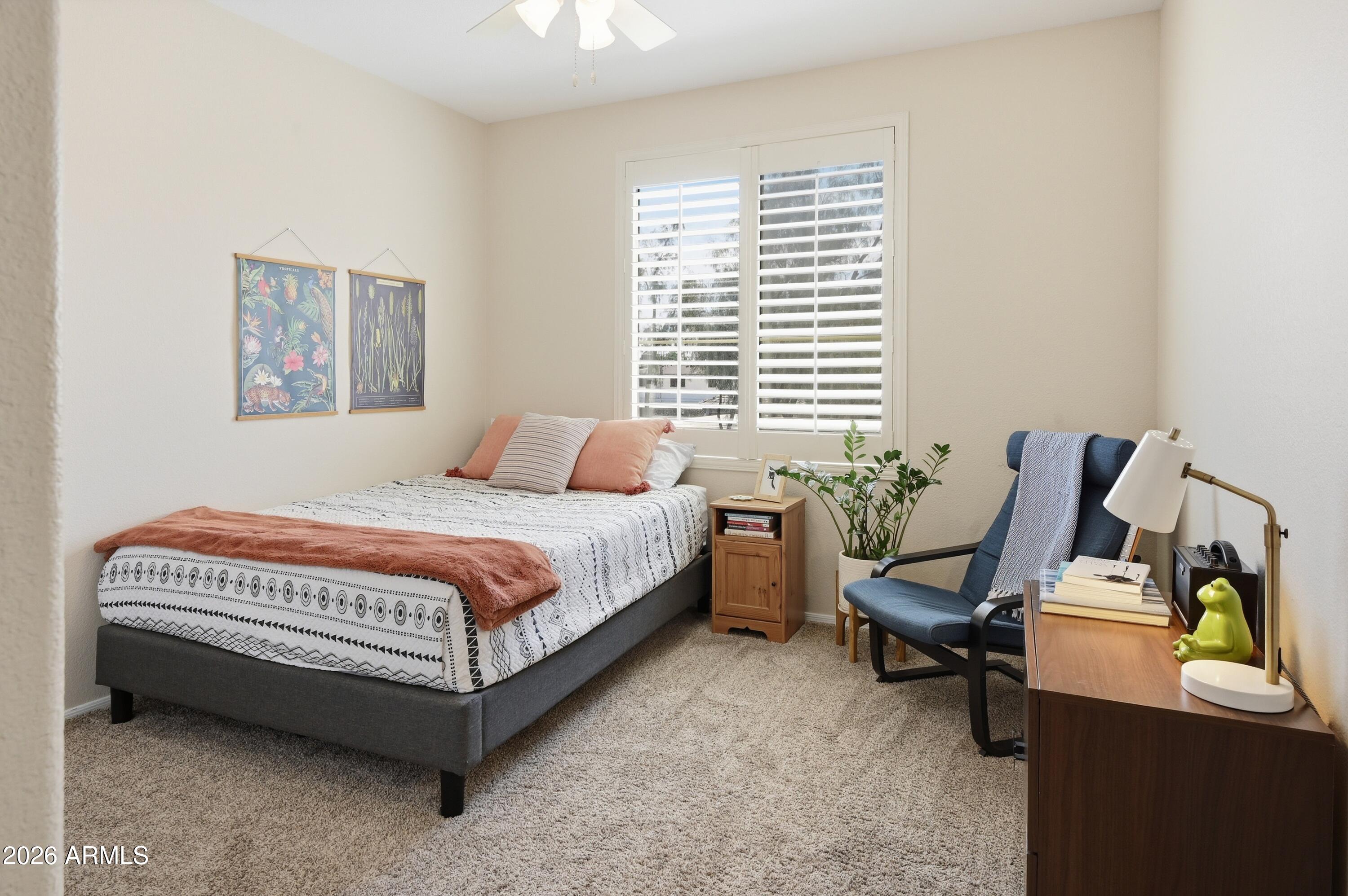 5303 North 7th Street, Unit 220 Phoenix, AZ 85014 - Photo 21 of 33 a bedroom with a bed wooden floor and a window