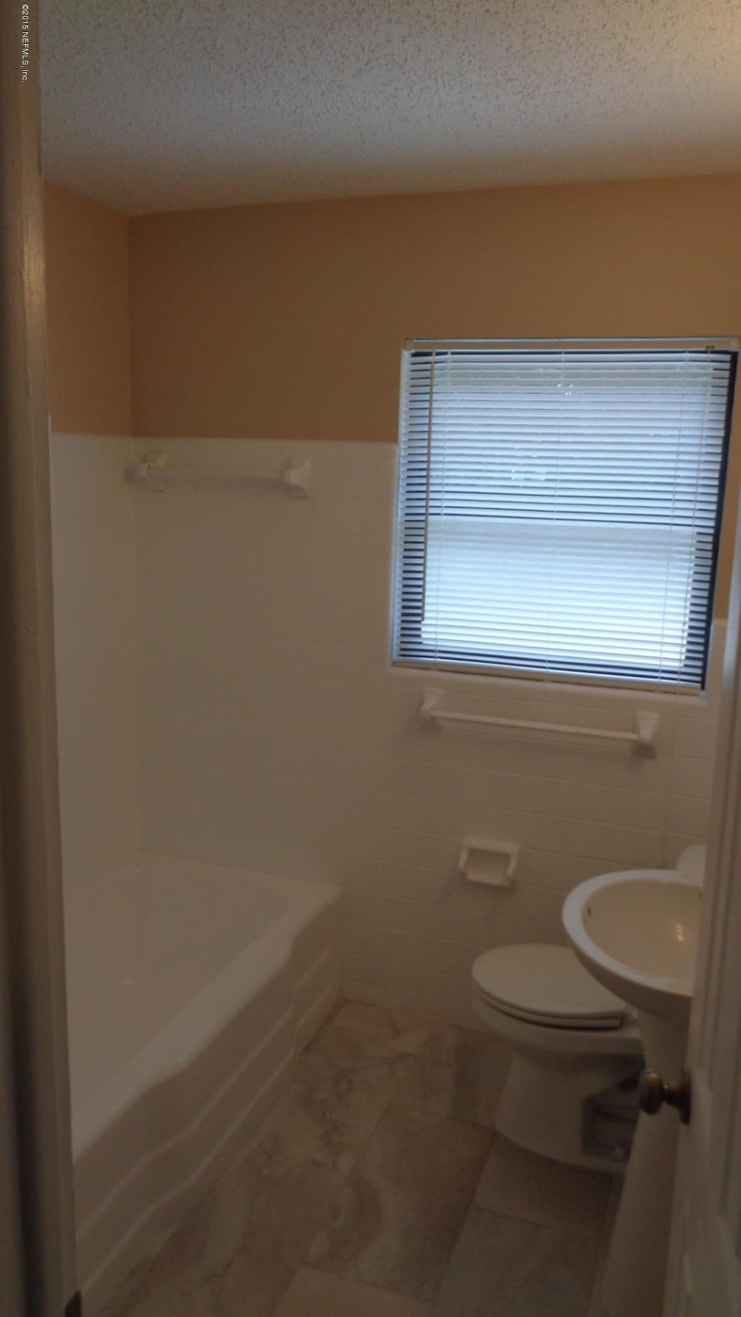 3376 Rogero Road Jacksonville, FL 32277 - Photo 7 of 7 a bathroom with a toilet