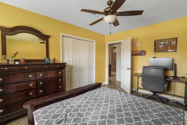 a bedroom with a bed and a dresser