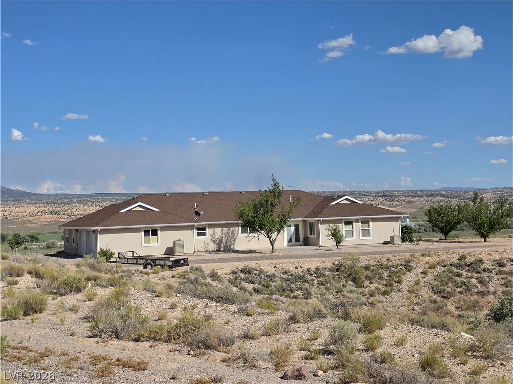 5272 Truman Lane Caliente, NV 89008 - Photo 35 of 43 Perched atop a hill, this desert home captures wide-ranging views of the natural landscape.