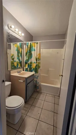 a bathroom with a toilet a sink a bath tub and shower