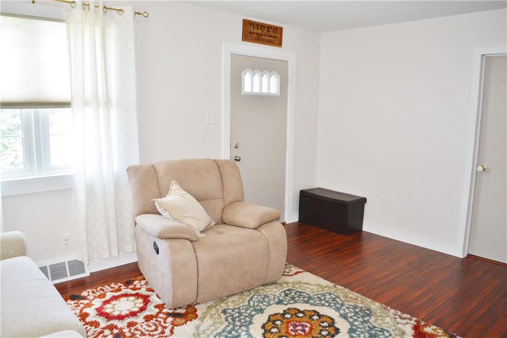 148 Altman Road Jeannette, PA 15644 - Photo 8 of 25 living room with door to mudroom/entryway of house