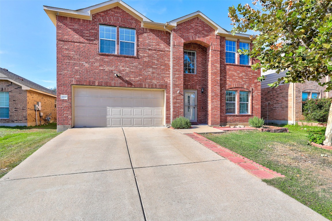 1520 Tonia Loop Round Rock, TX 78665 - Photo 1 of 32 a front view of a house with a yard and garage