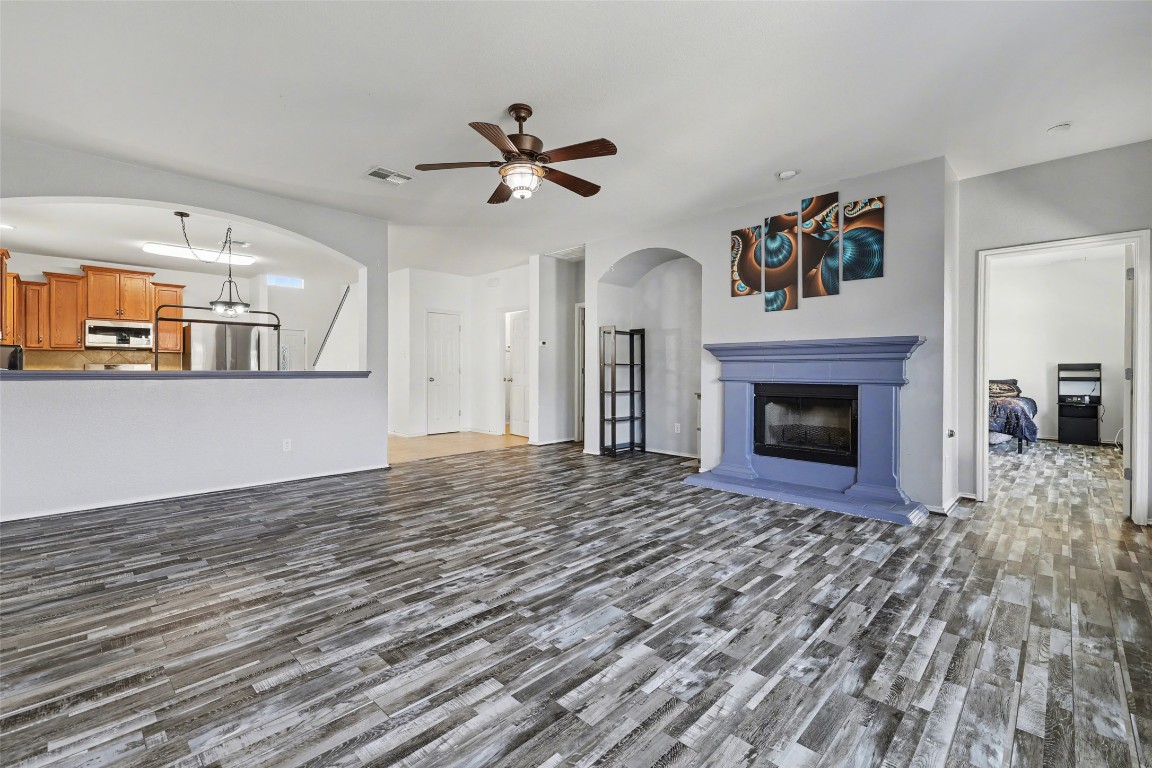 1520 Tonia Loop Round Rock, TX 78665 - Photo 12 of 32 a view of empty room with wooden floor and fireplace
