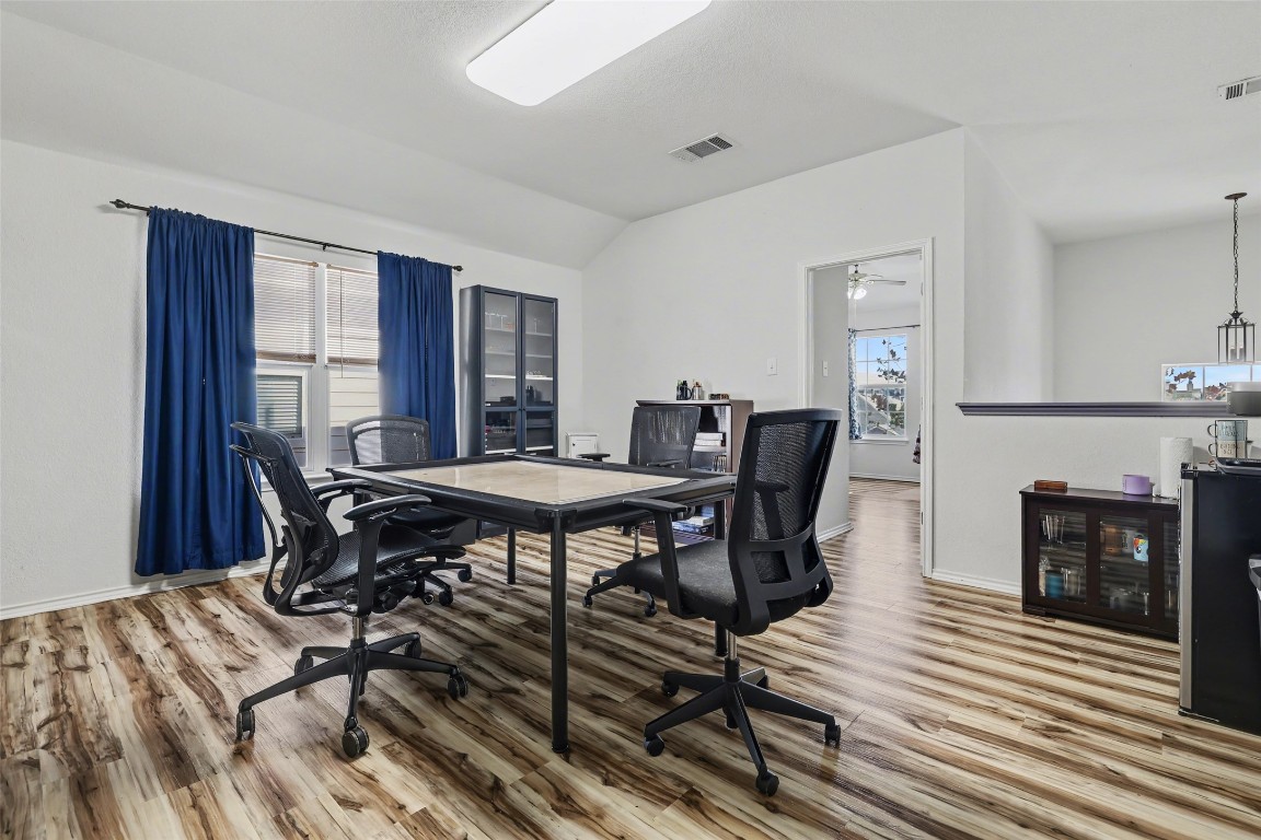 1520 Tonia Loop Round Rock, TX 78665 - Photo 23 of 32 a view of a dining room with furniture and wooden floor