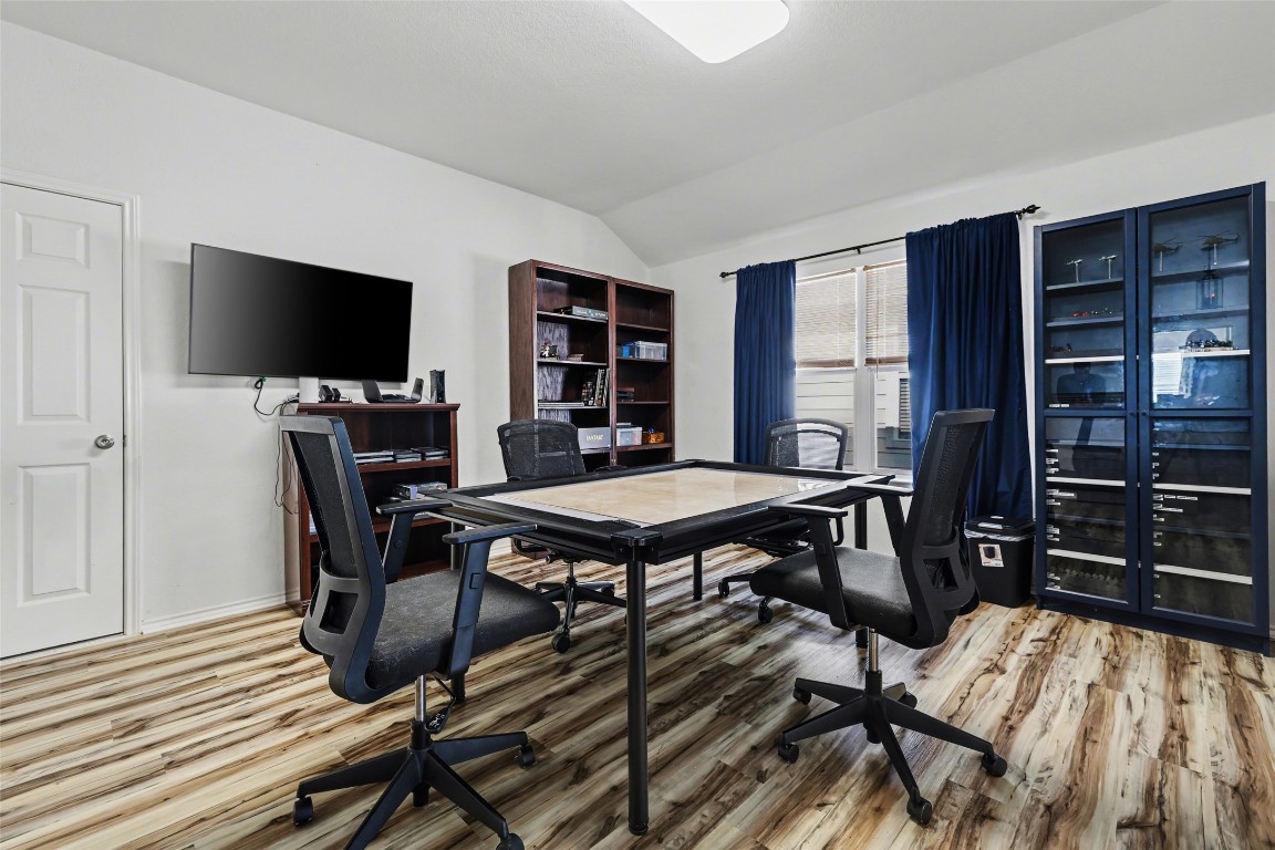 1520 Tonia Loop Round Rock, TX 78665 - Photo 24 of 32 a view of a dining room with furniture and wooden floor