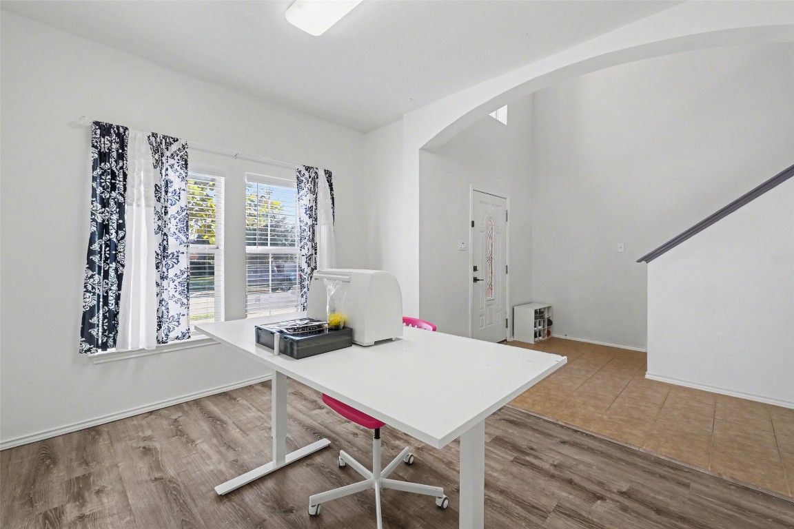 1520 Tonia Loop Round Rock, TX 78665 - Photo 4 of 32 a view of a dining room with furniture window and wooden floor