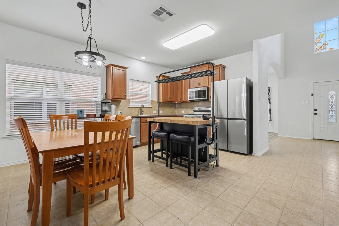 1520 Tonia Loop Round Rock, TX 78665 - Photo 8 of 32 a view of a dining room with furniture