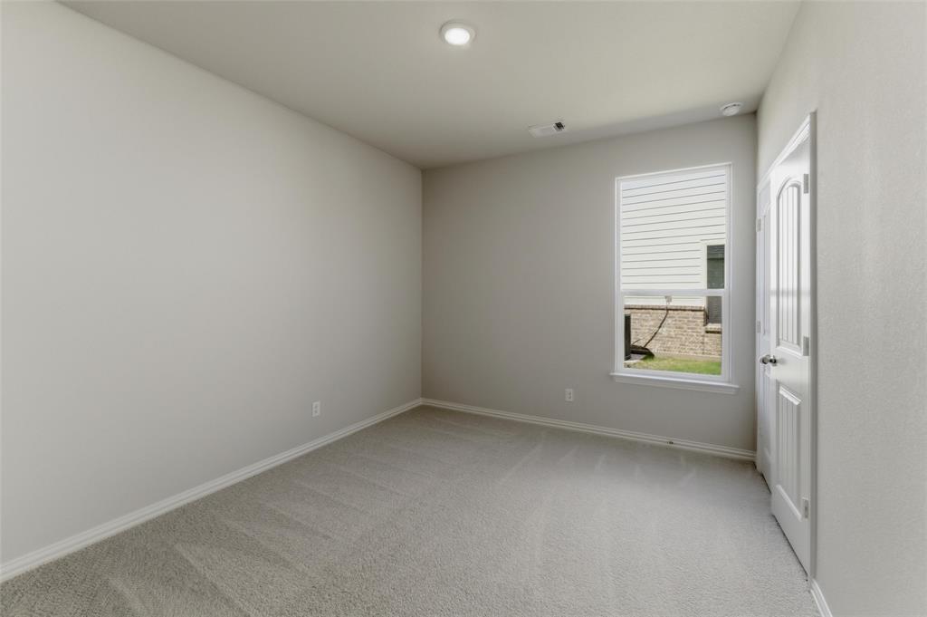 1225 Sabine River Lane Springtown, TX 76082 - Photo 11 of 25 Unfurnished room with light colored carpet and baseboards