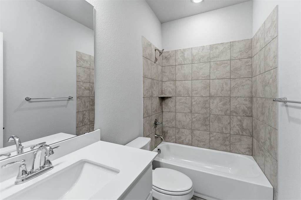 1225 Sabine River Lane Springtown, TX 76082 - Photo 13 of 25 Bathroom with vanity and shower combination