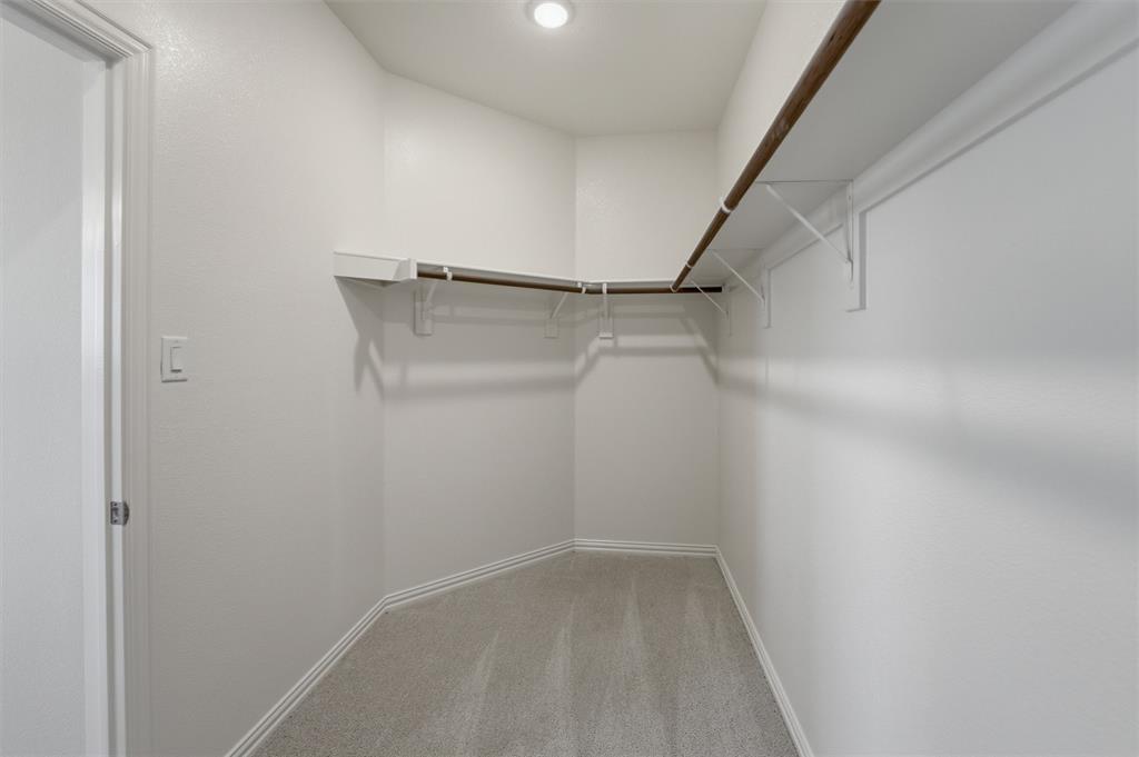 1225 Sabine River Lane Springtown, TX 76082 - Photo 18 of 25 Walk in closet with light carpet