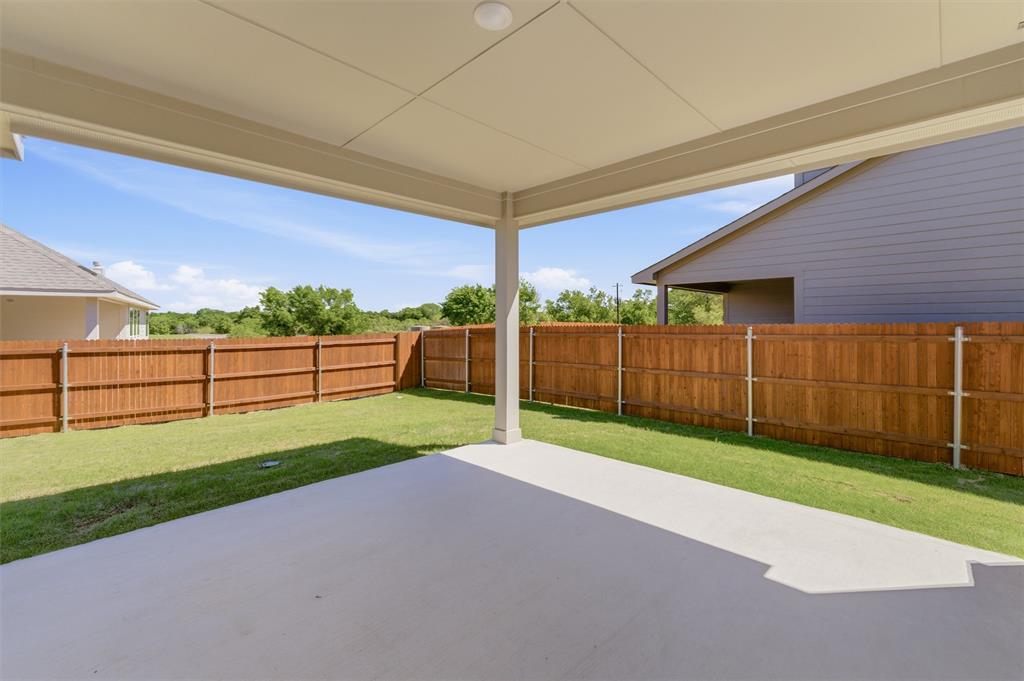1225 Sabine River Lane Springtown, TX 76082 - Photo 19 of 25 Fenced backyard with a patio