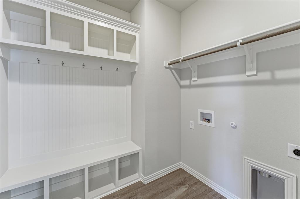 1225 Sabine River Lane Springtown, TX 76082 - Photo 7 of 25 Laundry area with dark wood-style flooring, hookup for a washing machine, hookup for a gas dryer, and hookup for an electric dryer