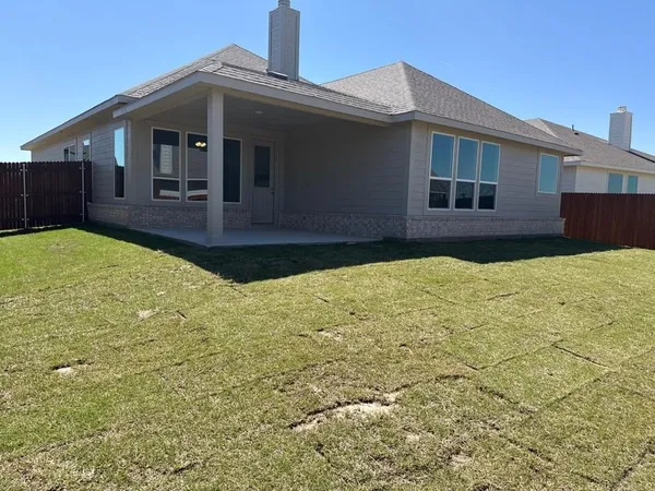 a front view of a house with yard