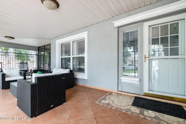 a view of a kitchen counter space and windows