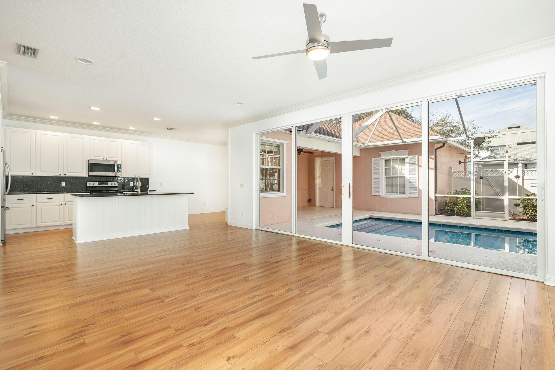 214 New Haven Boulevard Jupiter, FL 33458 - Photo 12 of 40 a view of a kitchen with wooden floor and a kitchen