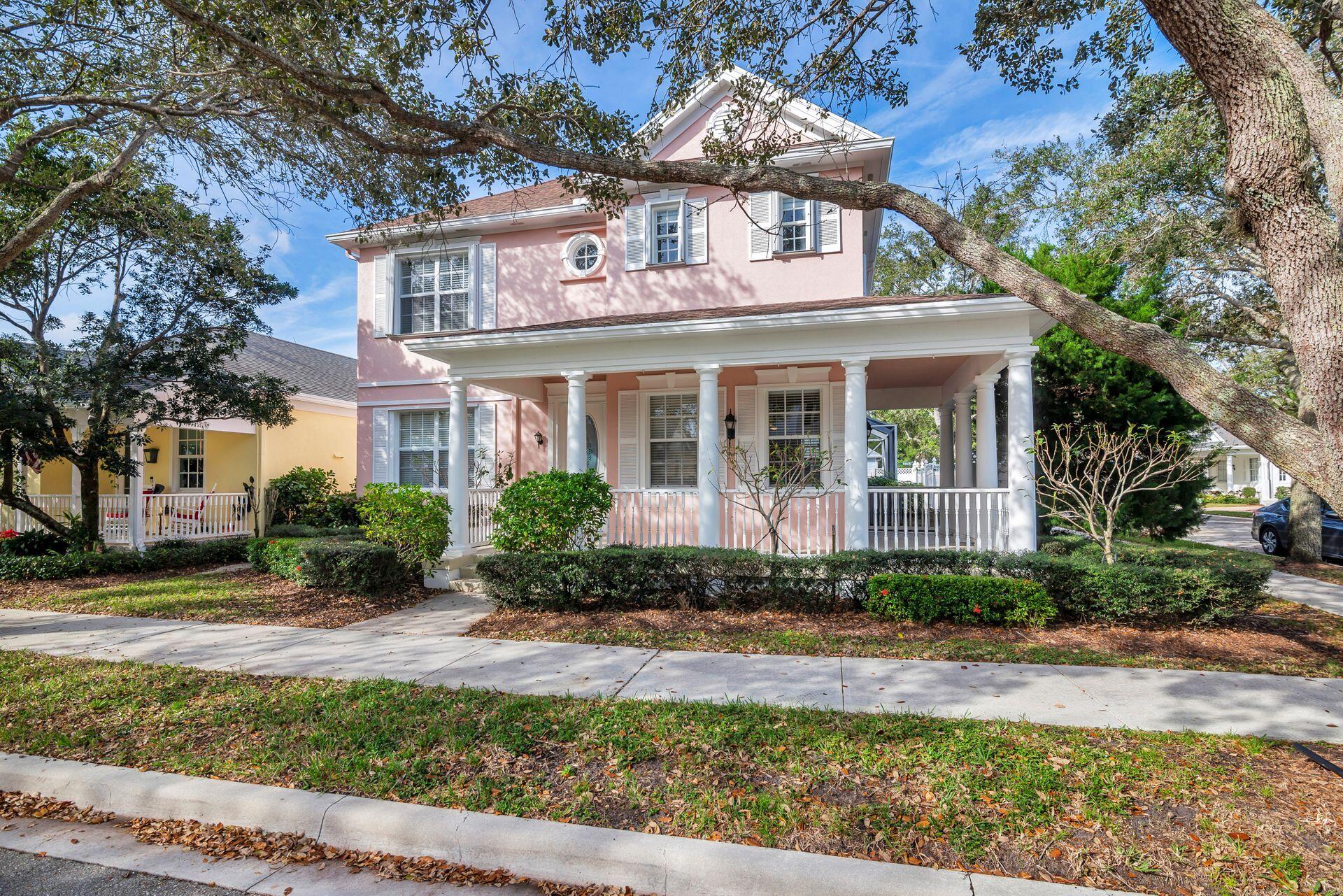 214 New Haven Boulevard Jupiter, FL 33458 - Photo 2 of 40 a front view of a house with a garden
