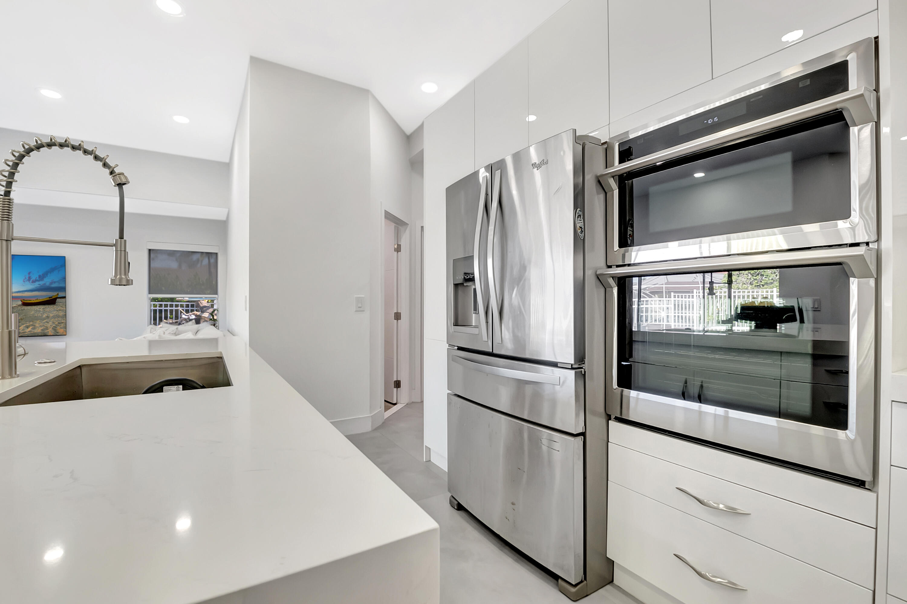 22330 Kettle Creek Way Boca Raton, FL 33428 - Photo 4 of 75 a kitchen with stainless steel appliances a refrigerator and microwave