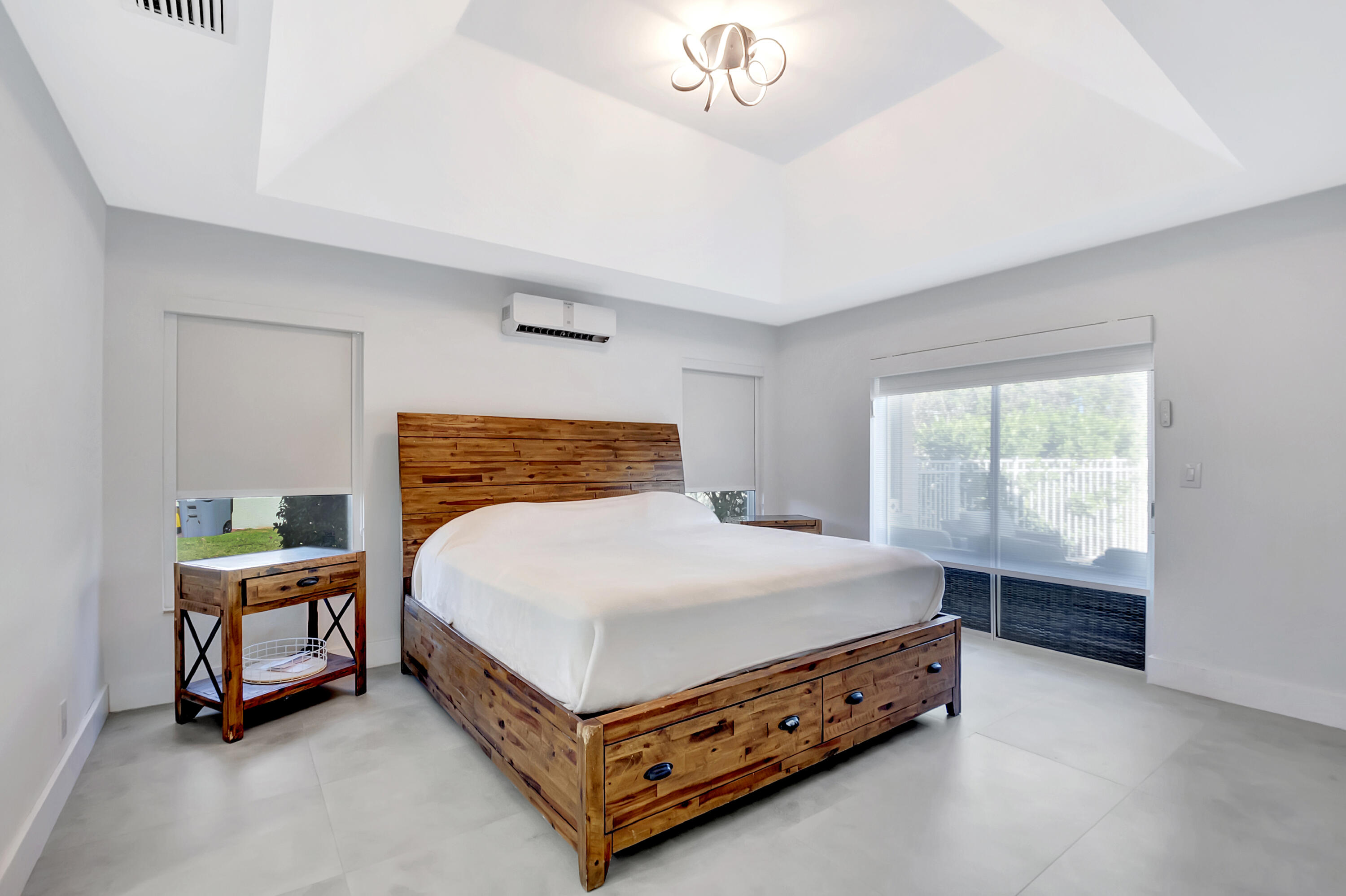 22330 Kettle Creek Way Boca Raton, FL 33428 - Photo 42 of 75 a bed sitting in a bedroom next to a window