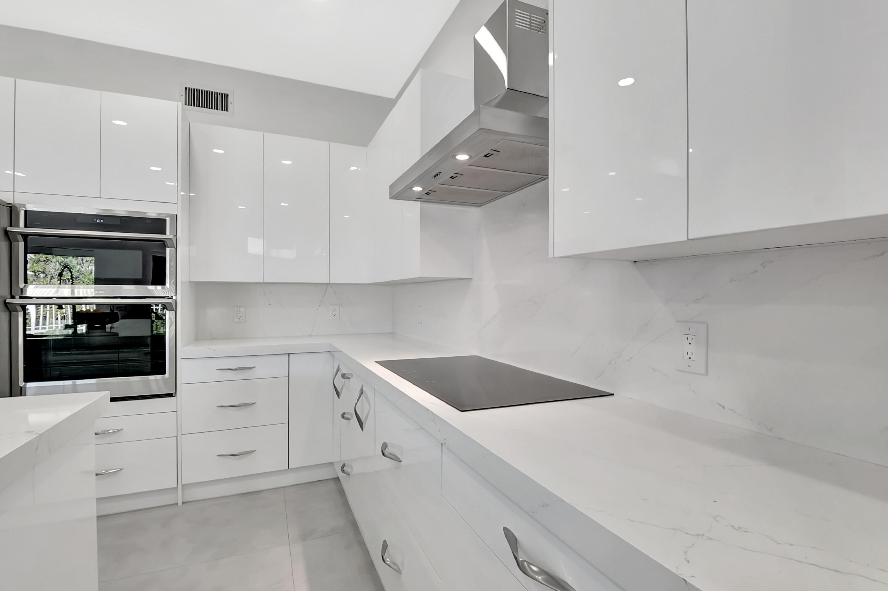 22330 Kettle Creek Way Boca Raton, FL 33428 - Photo 46 of 75 a kitchen with white cabinets and white appliances