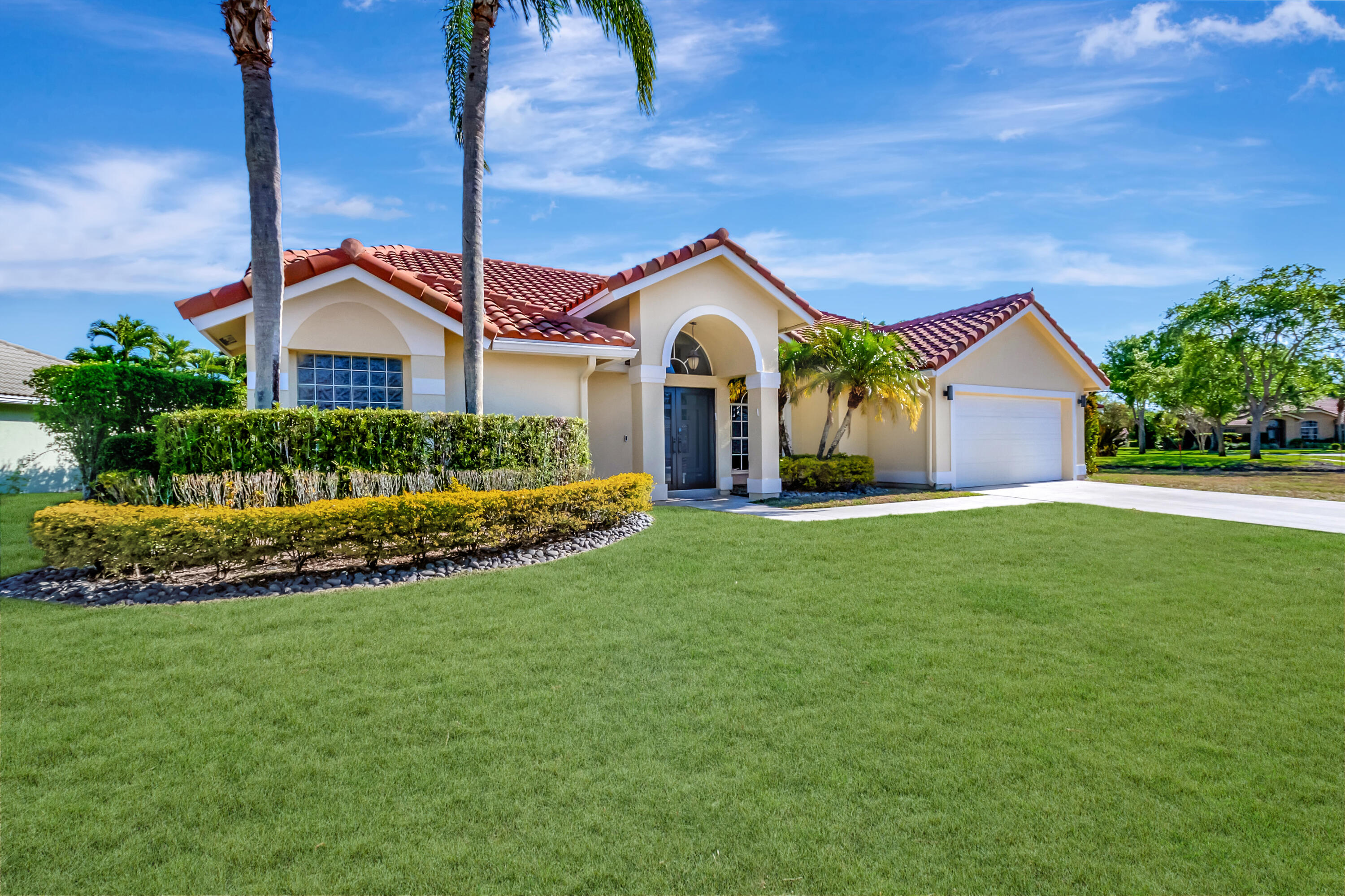 22330 Kettle Creek Way Boca Raton, FL 33428 - Photo 50 of 75 a front view of a house with a garden