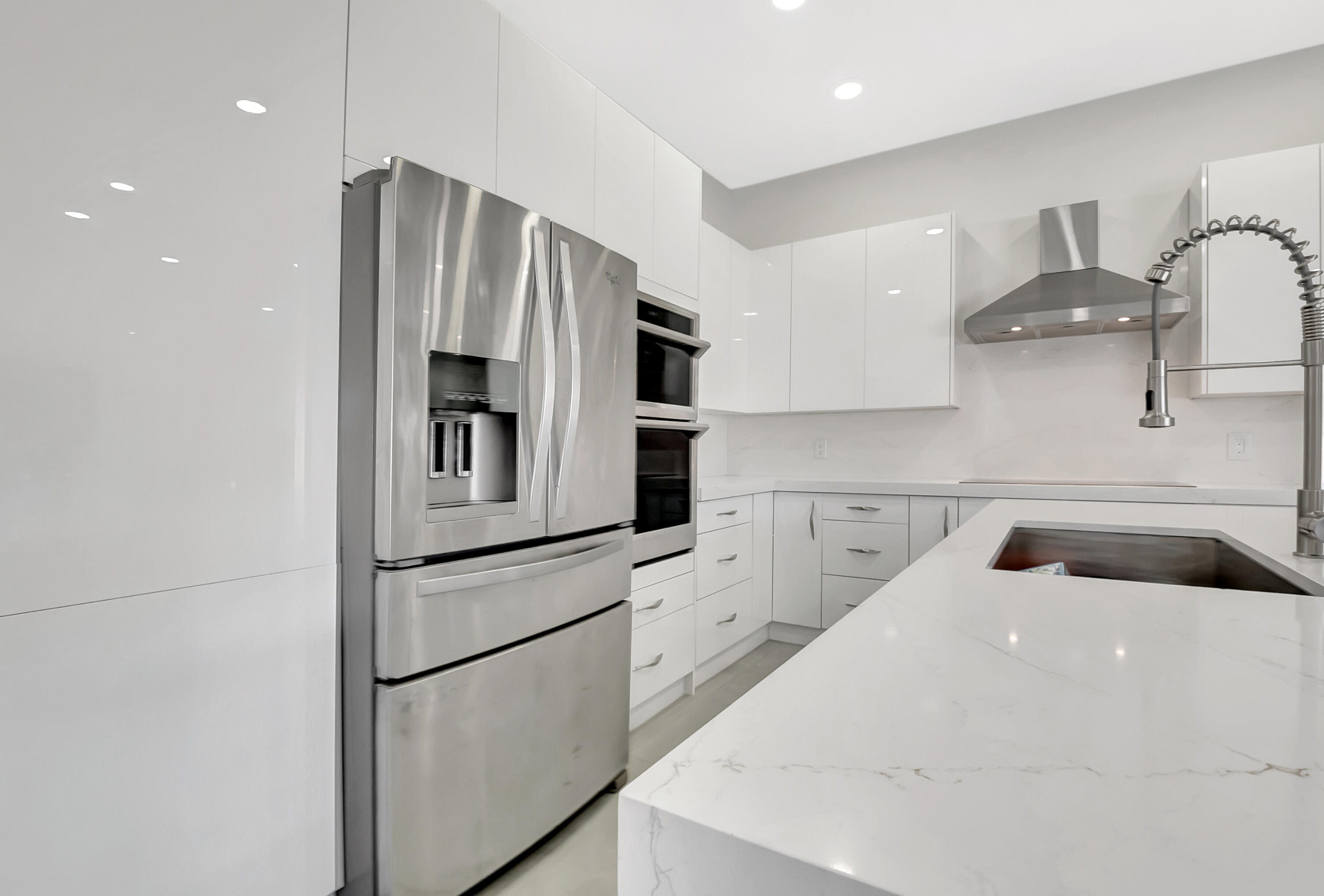 22330 Kettle Creek Way Boca Raton, FL 33428 - Photo 7 of 75 a kitchen with a refrigerator and cabinets