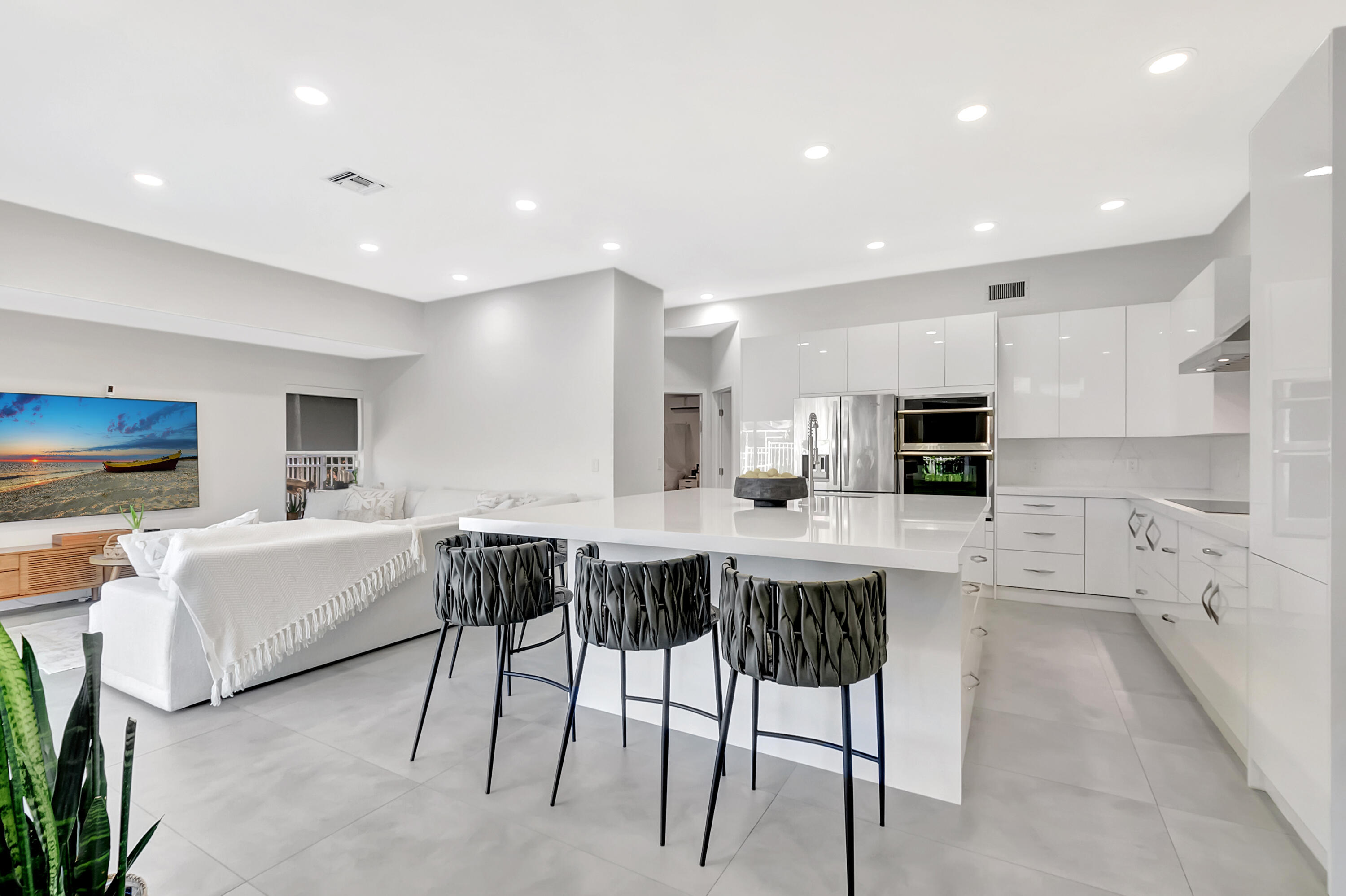 22330 Kettle Creek Way Boca Raton, FL 33428 - Photo 8 of 75 a kitchen with stainless steel appliances kitchen island granite countertop a sink and cabinets