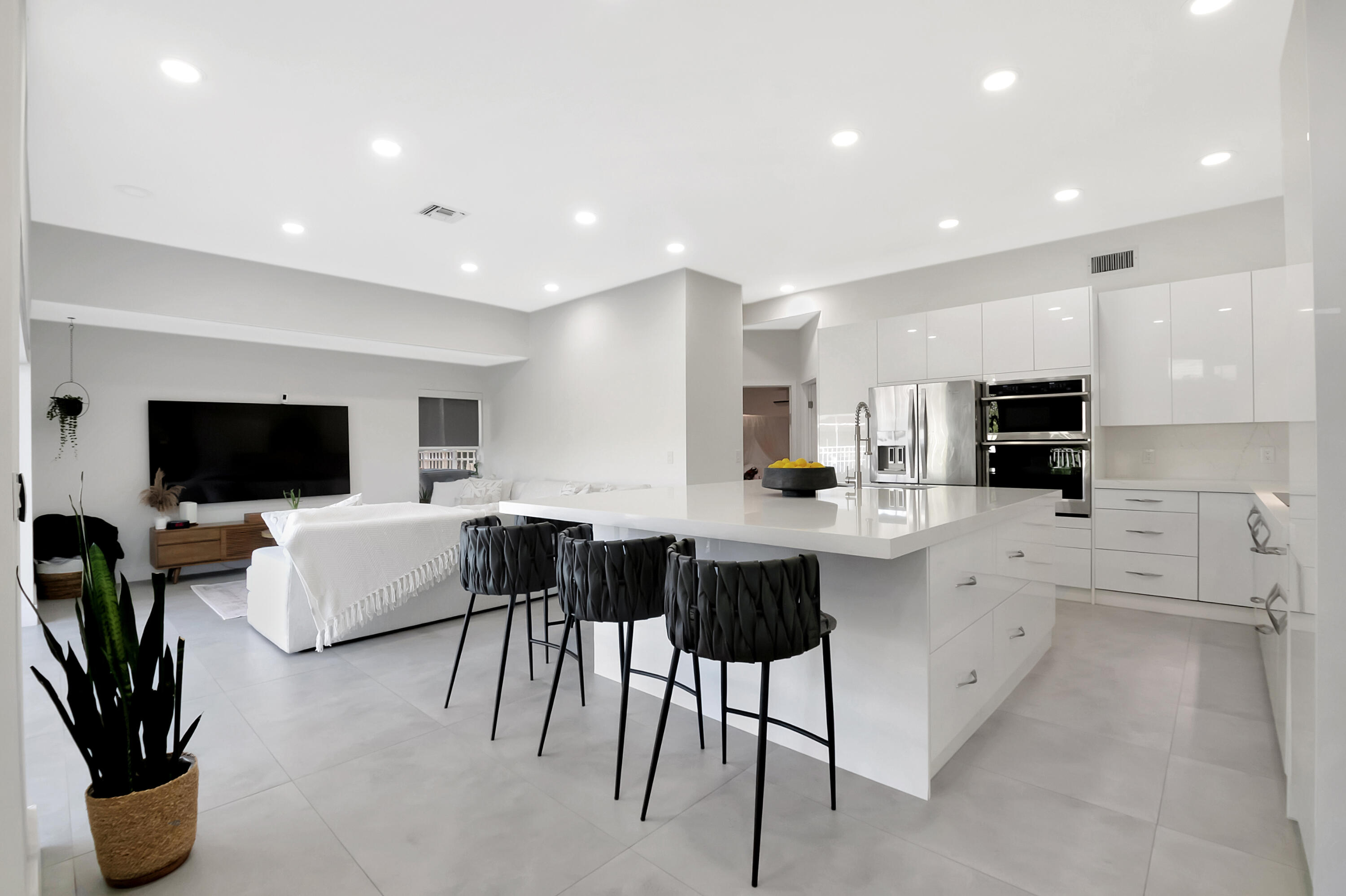 22330 Kettle Creek Way Boca Raton, FL 33428 - Photo 9 of 75 a kitchen with stainless steel appliances kitchen island granite countertop a refrigerator and cabinets