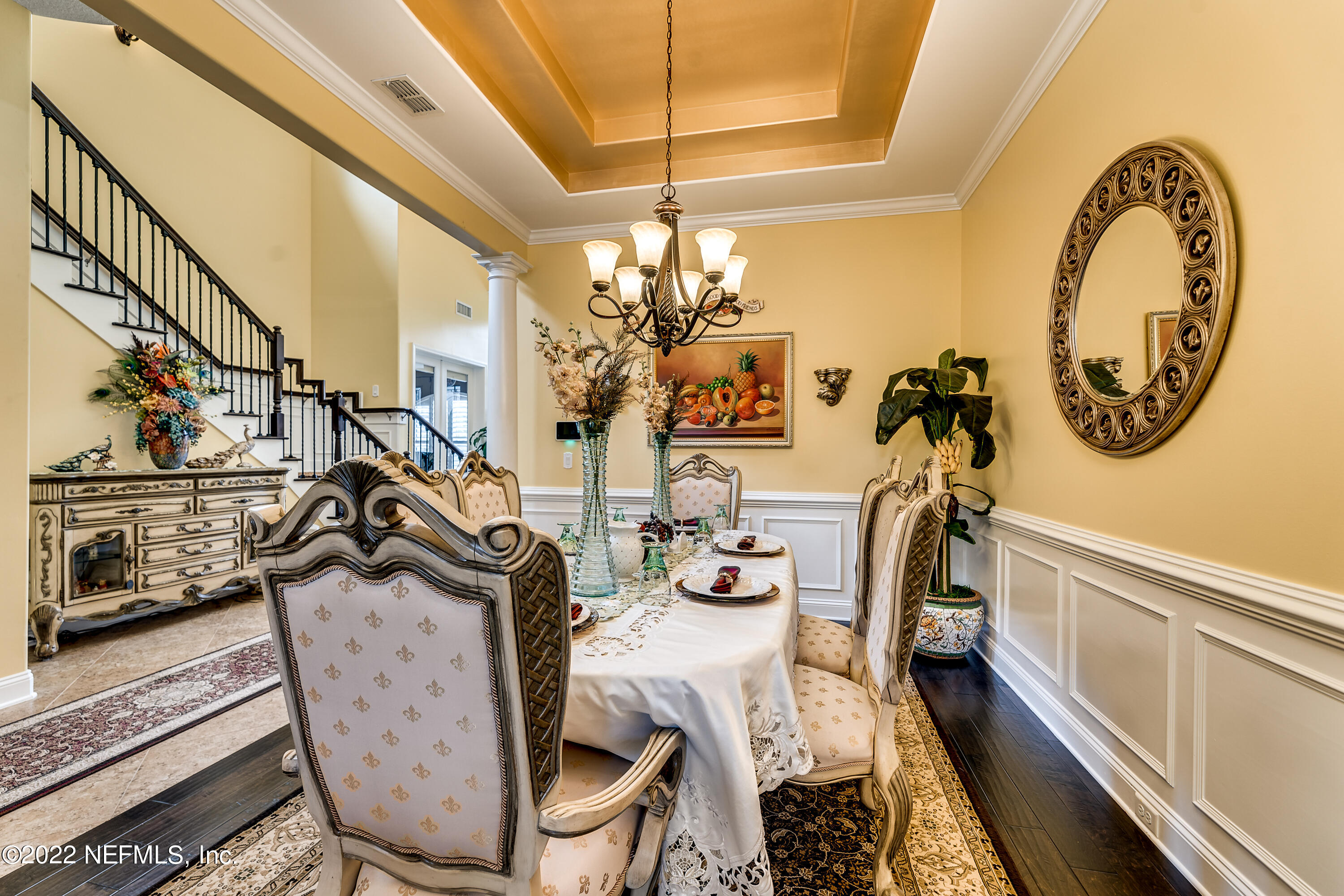 571 Saddlestone Drive Jacksonville, FL 32259 - Photo 12 of 65 a view of a dining room with furniture a chandelier and wooden floor