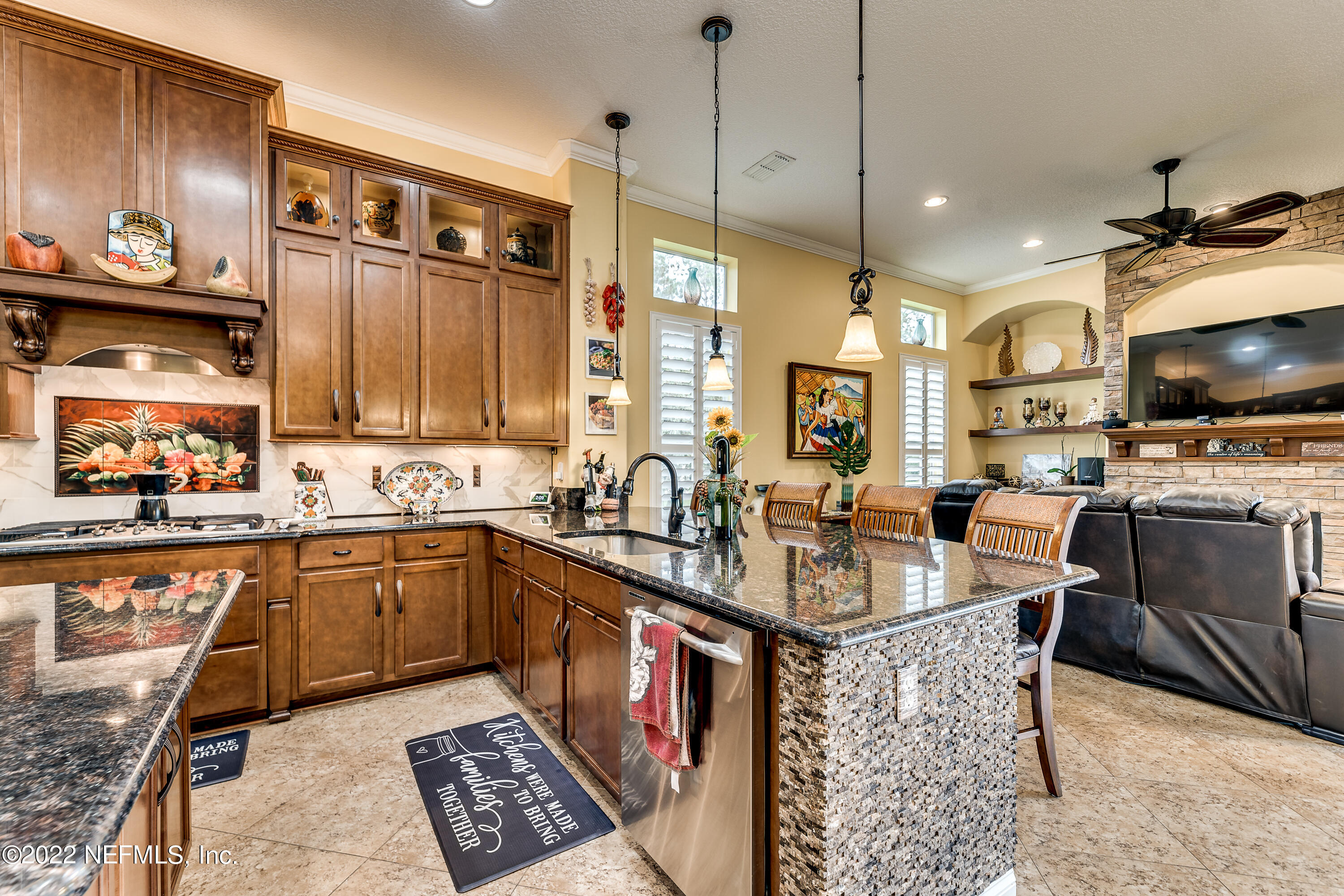 571 Saddlestone Drive Jacksonville, FL 32259 - Photo 18 of 65 a kitchen with stainless steel appliances granite countertop a sink stove and cabinets