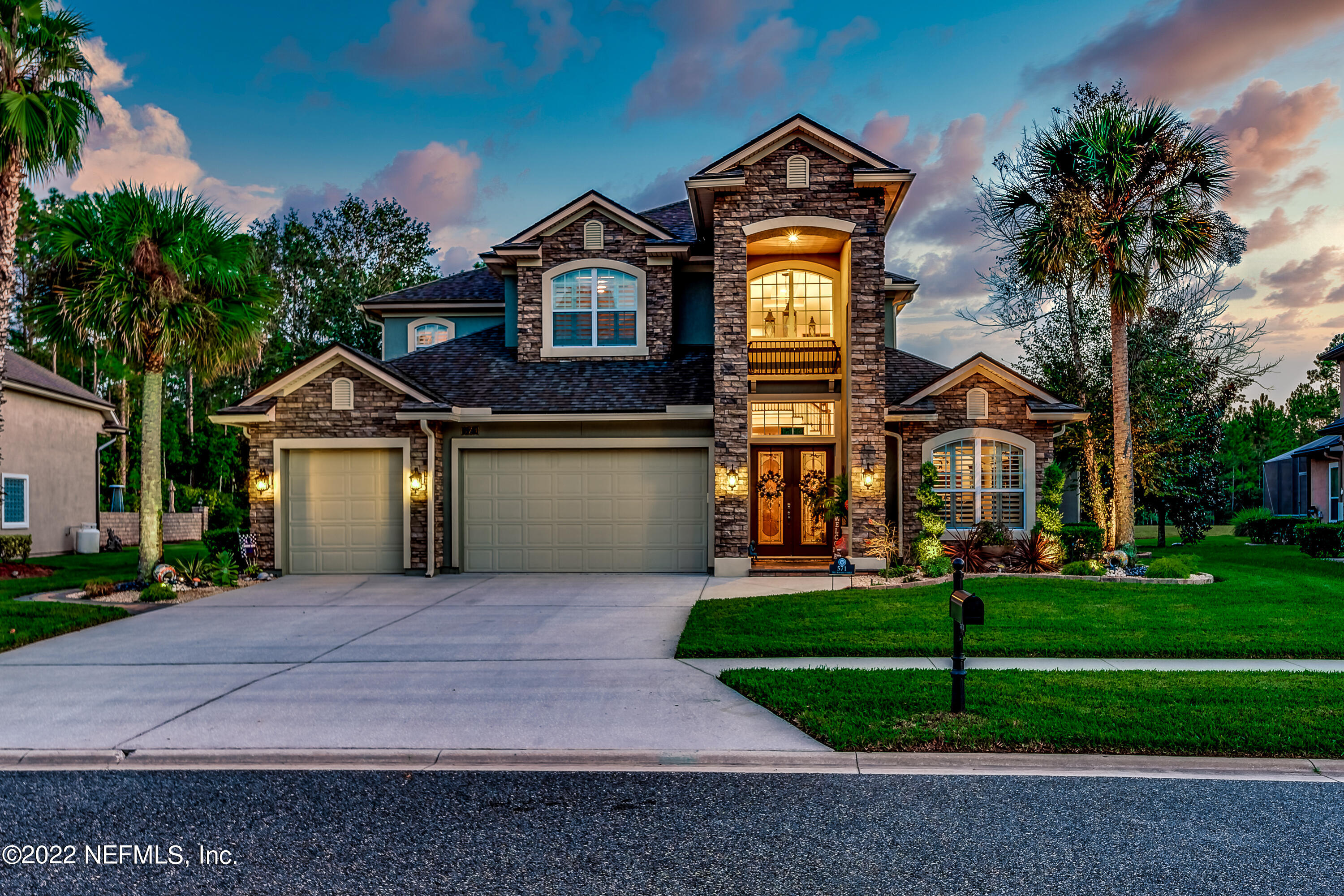 571 Saddlestone Drive Jacksonville, FL 32259 - Photo 2 of 65 a front view of a house with a yard and trees
