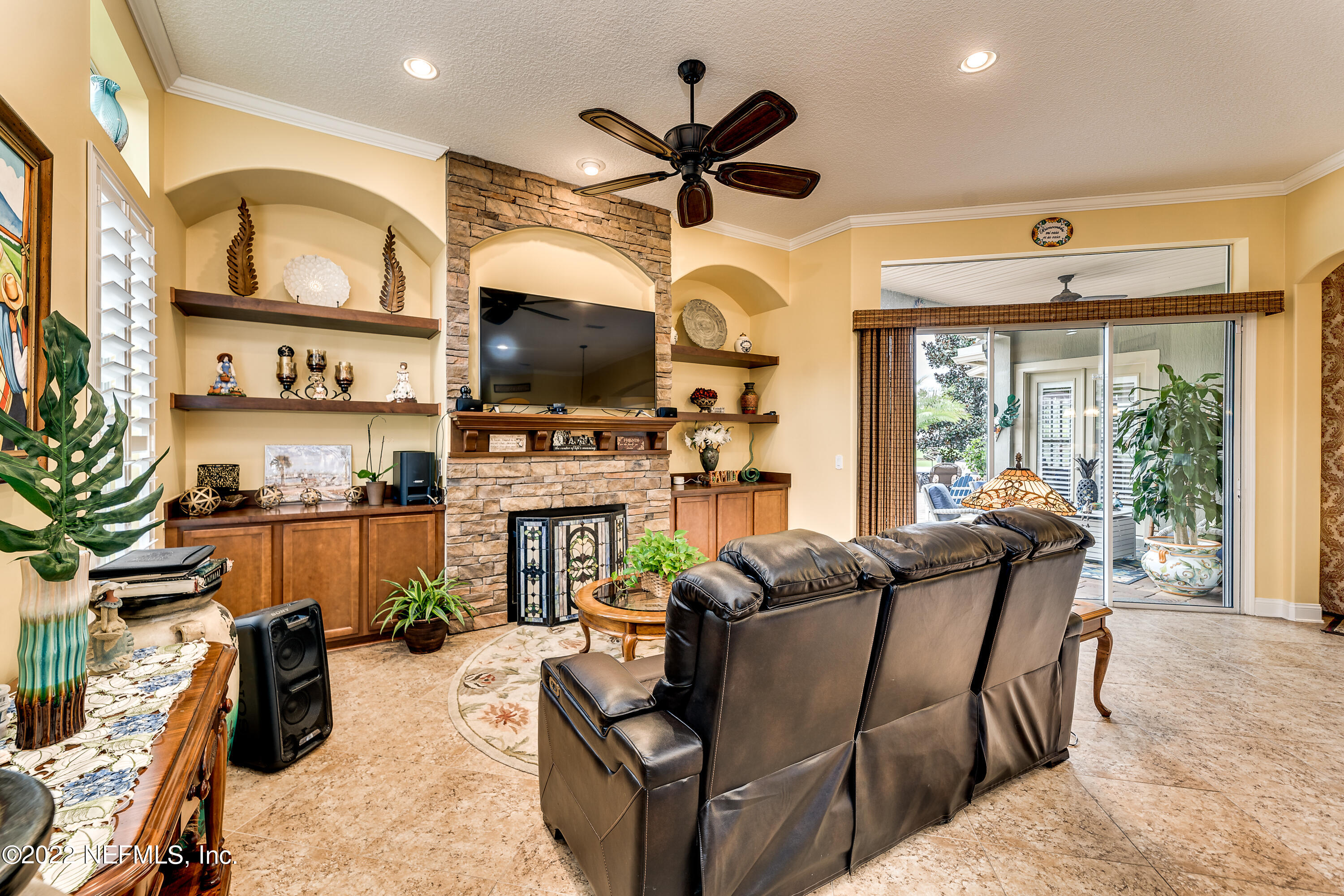 571 Saddlestone Drive Jacksonville, FL 32259 - Photo 21 of 65 a living room with fireplace furniture and a flat screen tv