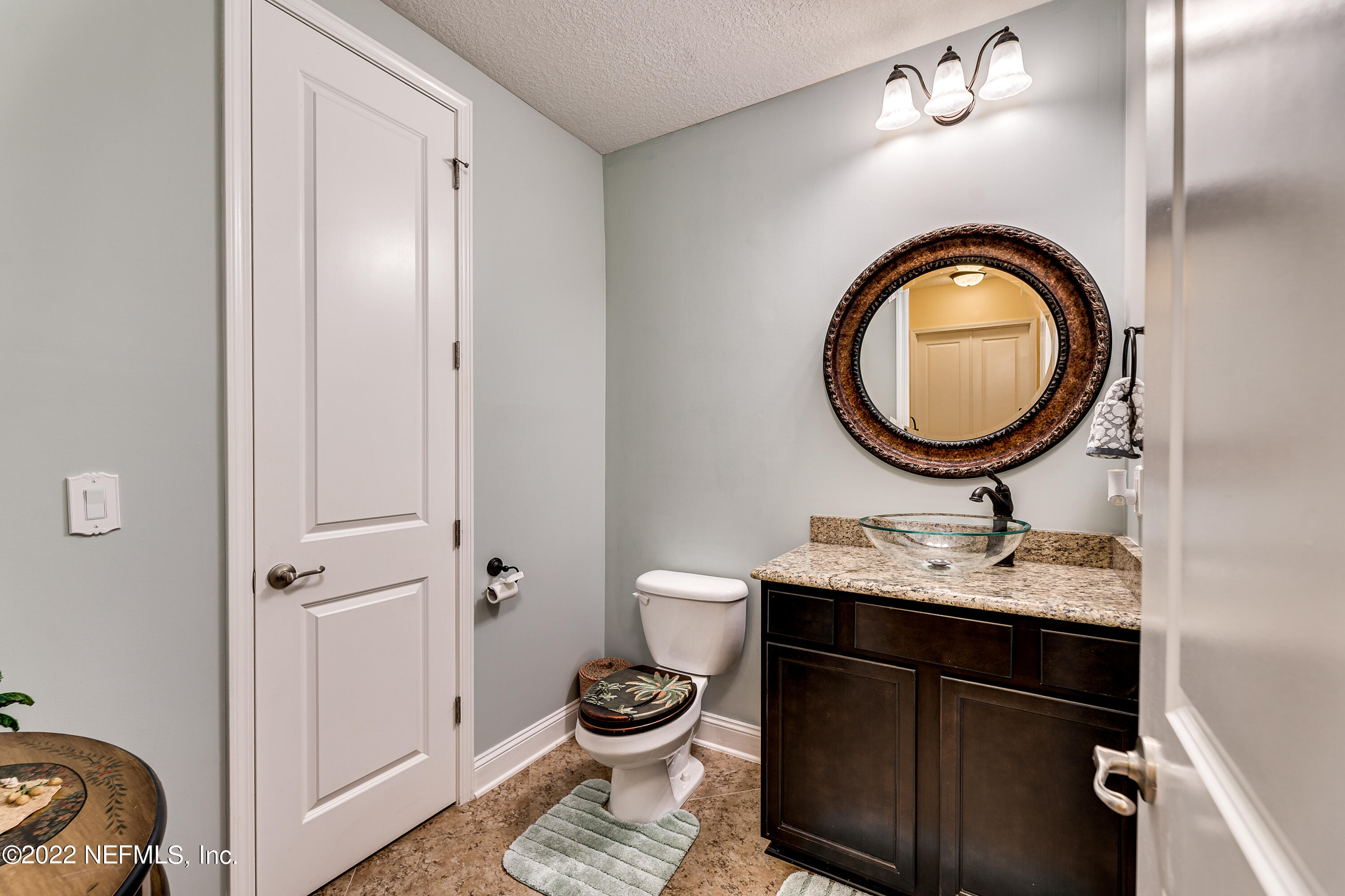 571 Saddlestone Drive Jacksonville, FL 32259 - Photo 23 of 65 a bathroom with a sink and a mirror