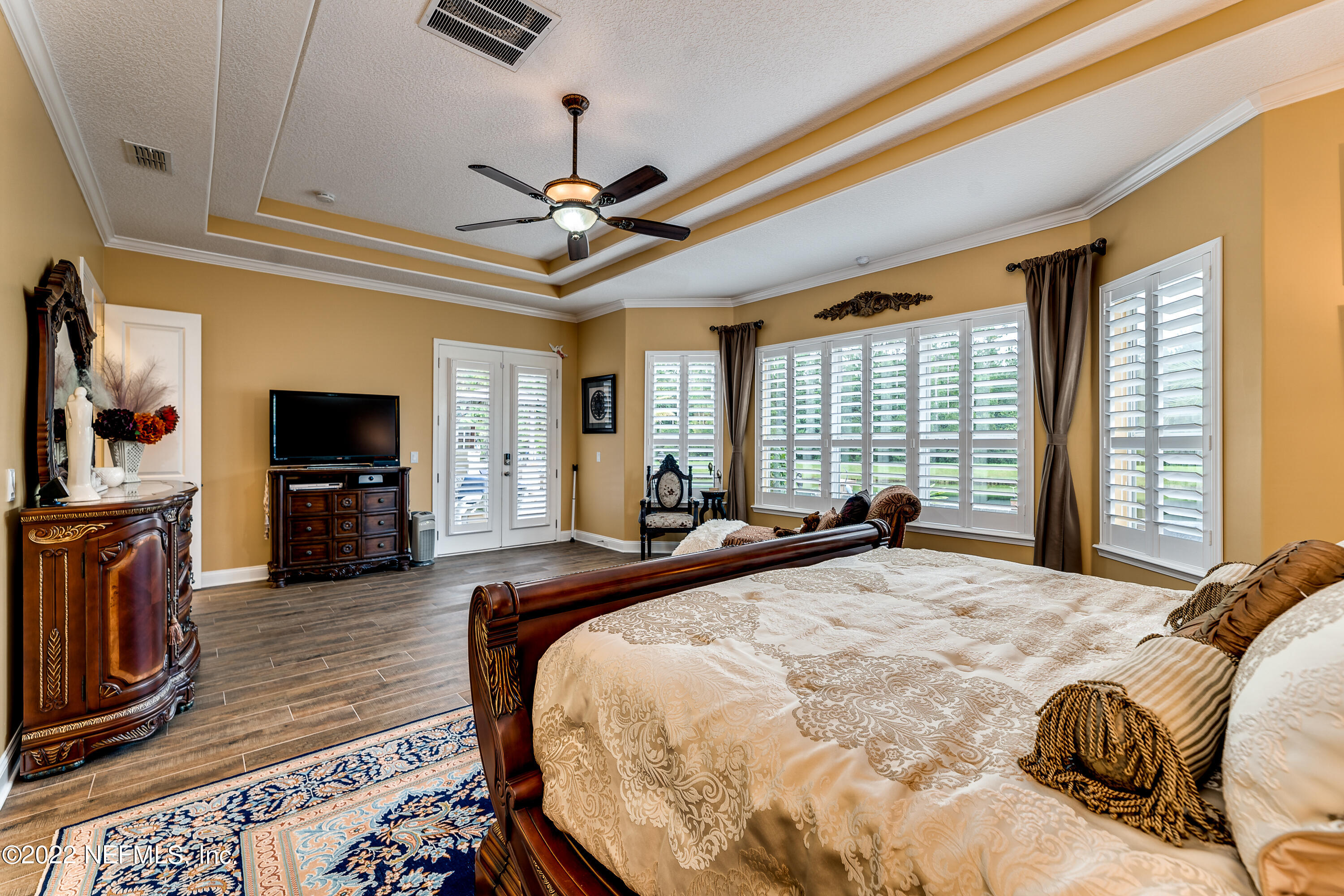 571 Saddlestone Drive Jacksonville, FL 32259 - Photo 28 of 65 a large bedroom with wooden floor and furniture