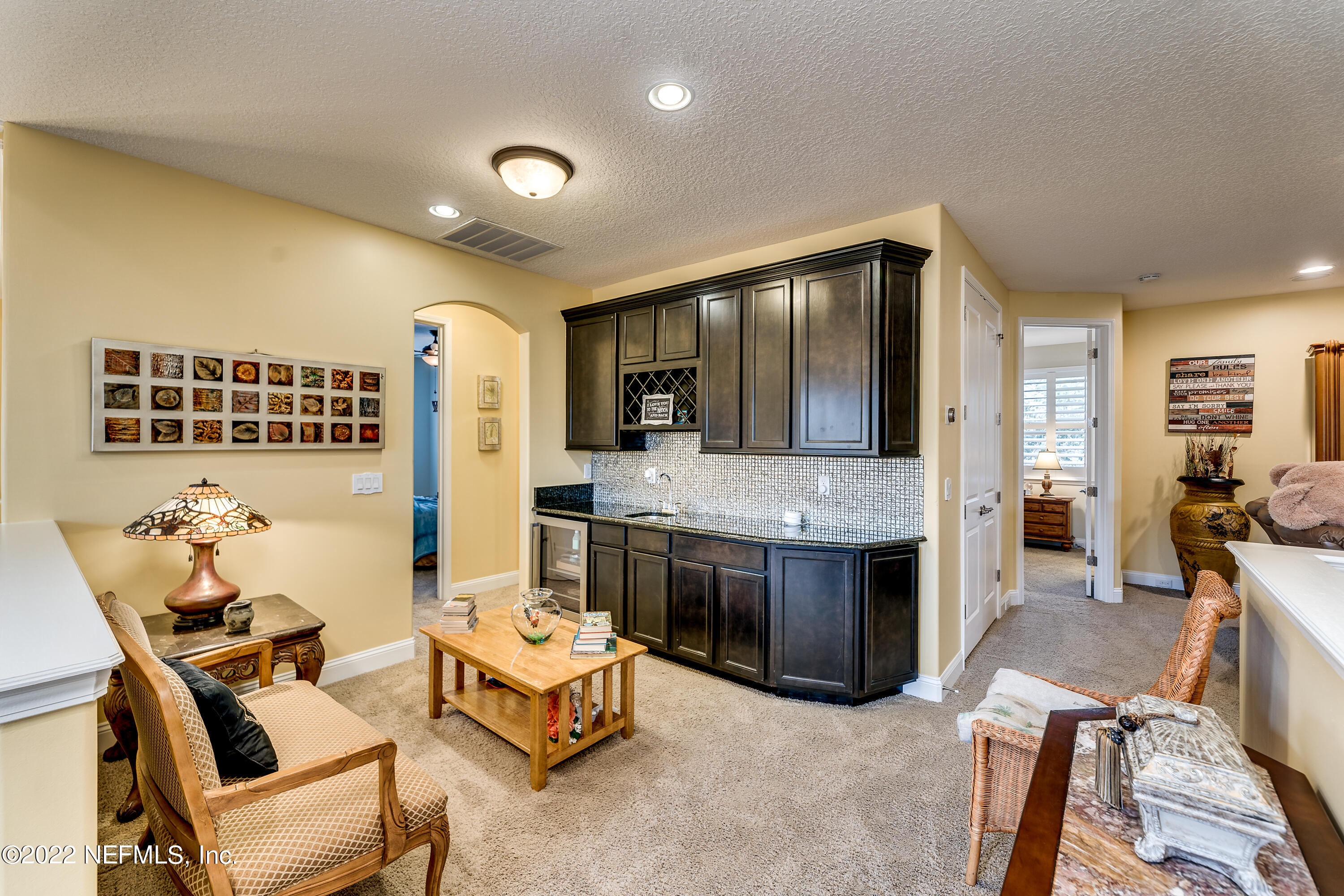 571 Saddlestone Drive Jacksonville, FL 32259 - Photo 33 of 65 a living room with furniture and flat screen tv