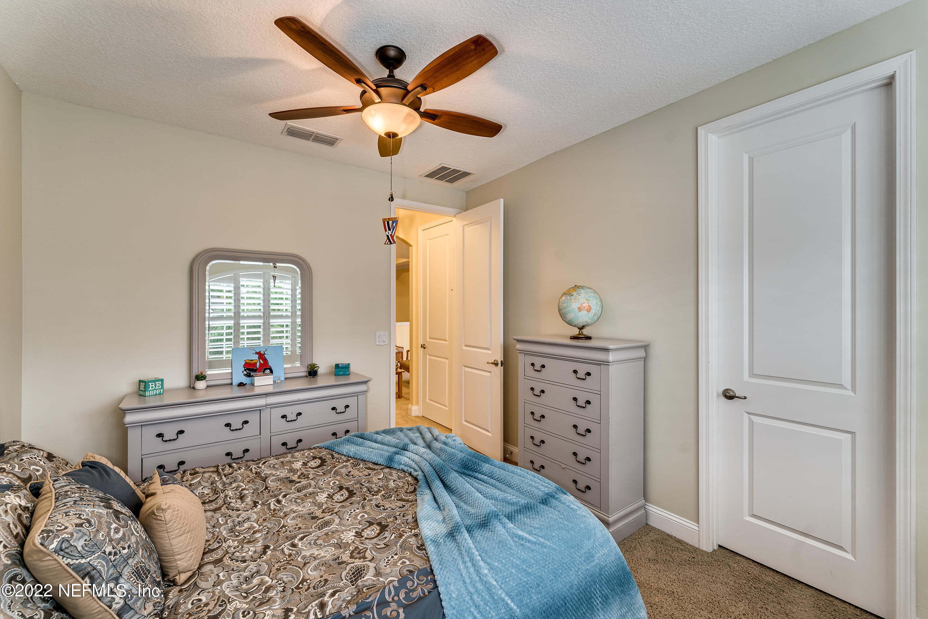 571 Saddlestone Drive Jacksonville, FL 32259 - Photo 41 of 65 a bedroom with a bed and a dresser
