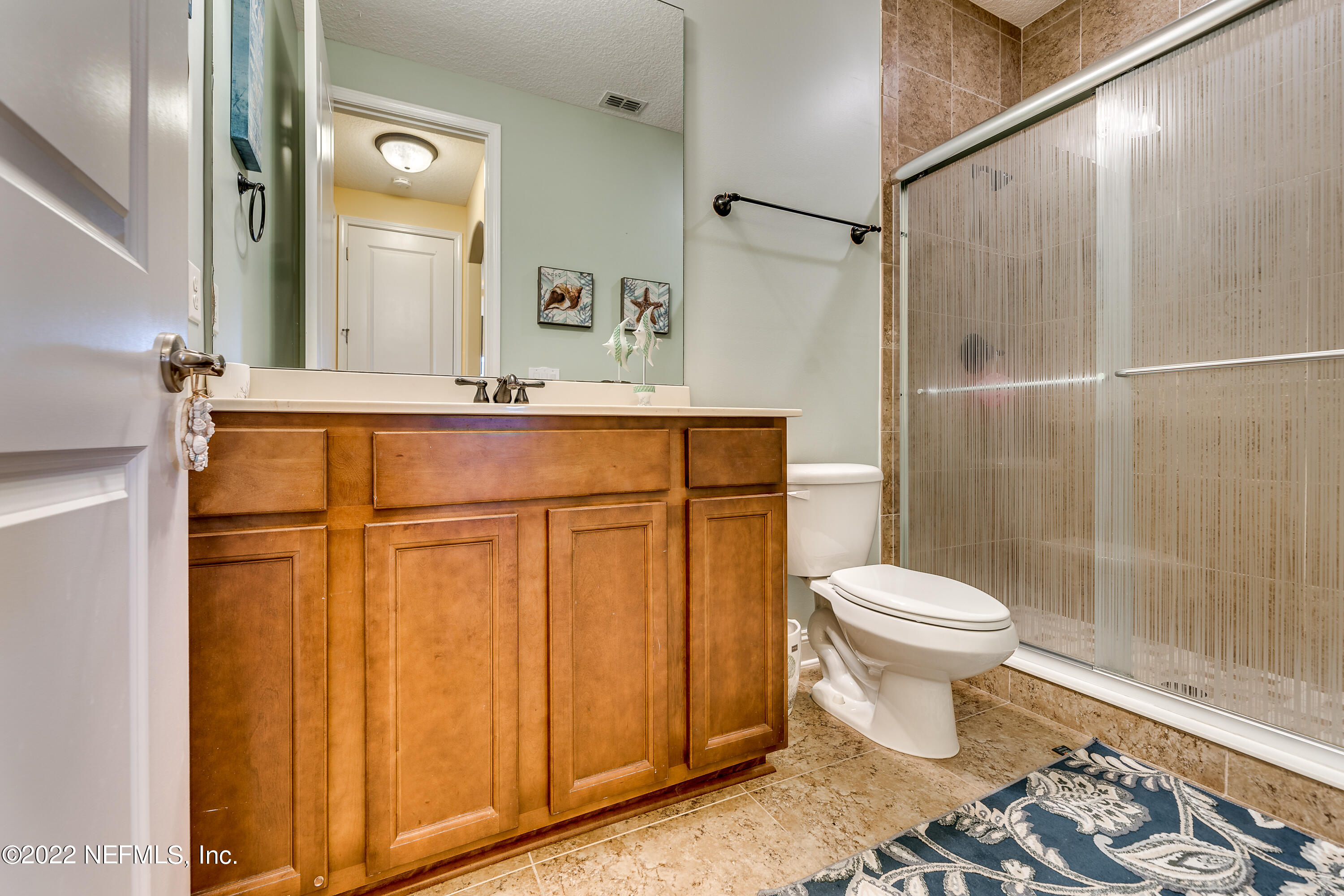 571 Saddlestone Drive Jacksonville, FL 32259 - Photo 42 of 65 a bathroom with a sink a toilet and shower