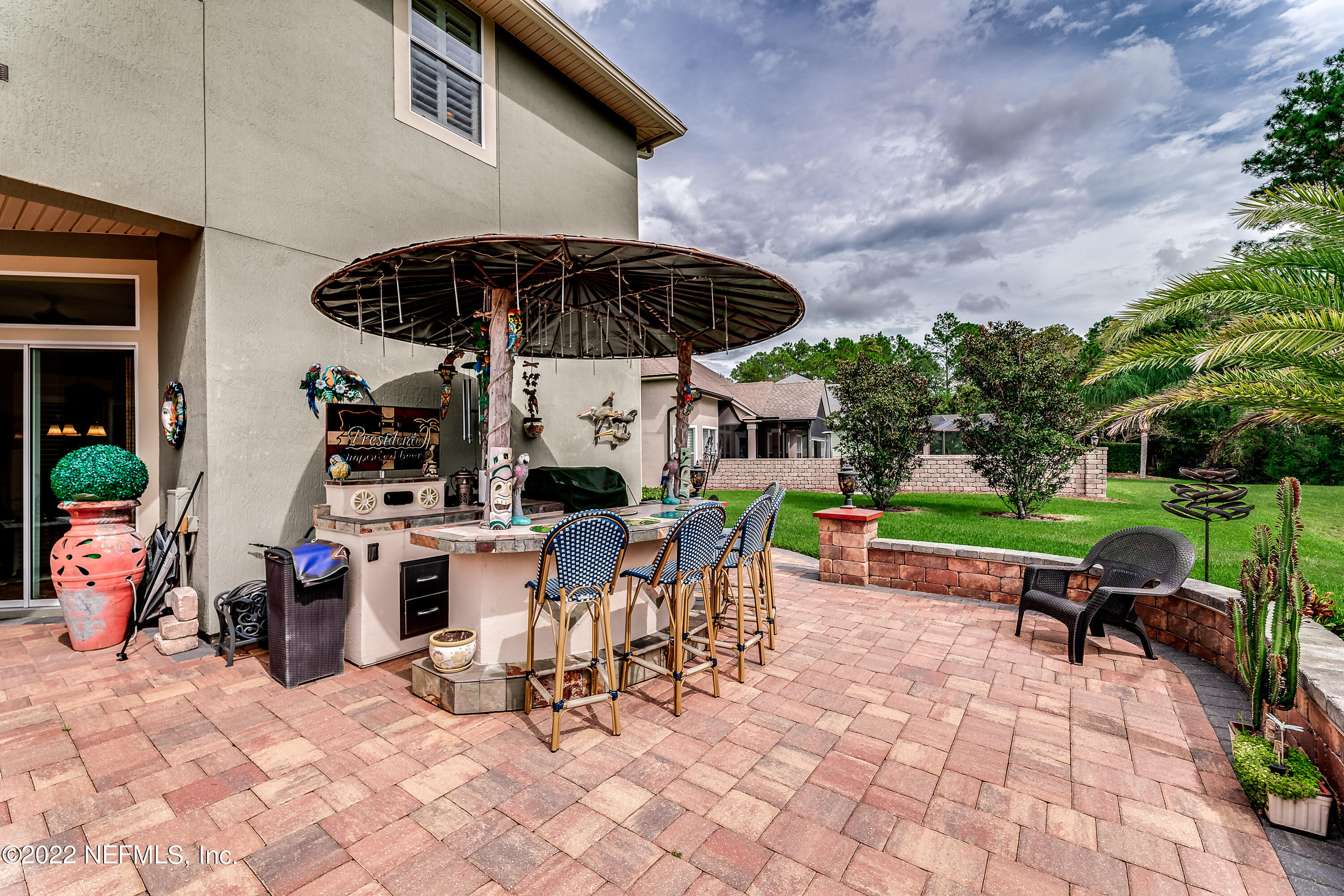 571 Saddlestone Drive Jacksonville, FL 32259 - Photo 55 of 65 a view of a chairs and table in backyard