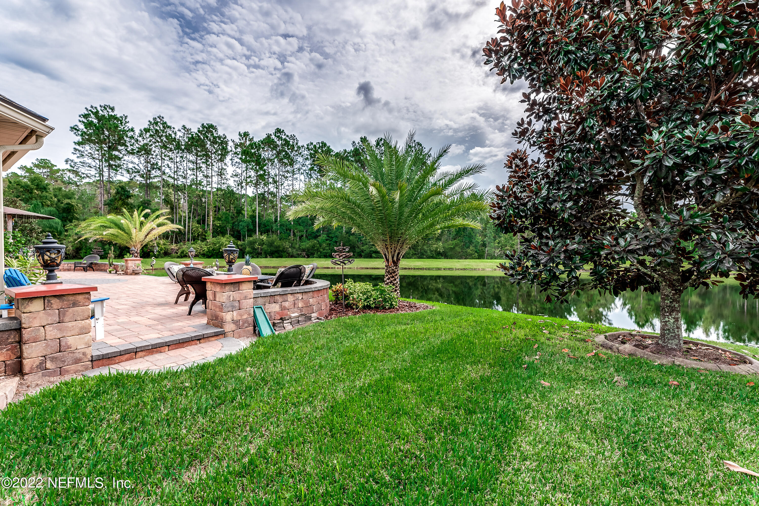 571 Saddlestone Drive Jacksonville, FL 32259 - Photo 58 of 65 a view of a backyard with sitting area