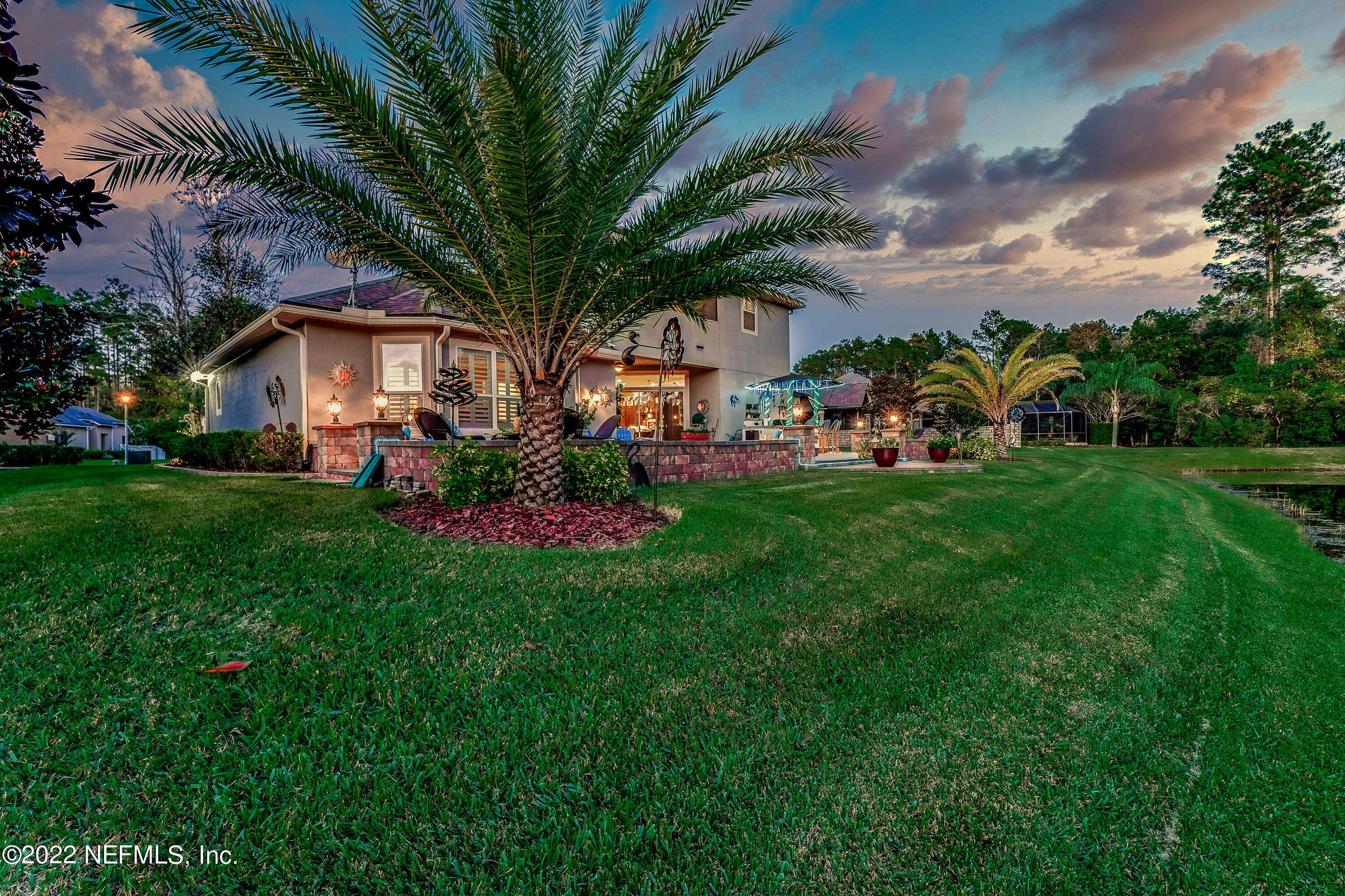 571 Saddlestone Drive Jacksonville, FL 32259 - Photo 60 of 65 a view of a house with a yard and sitting area