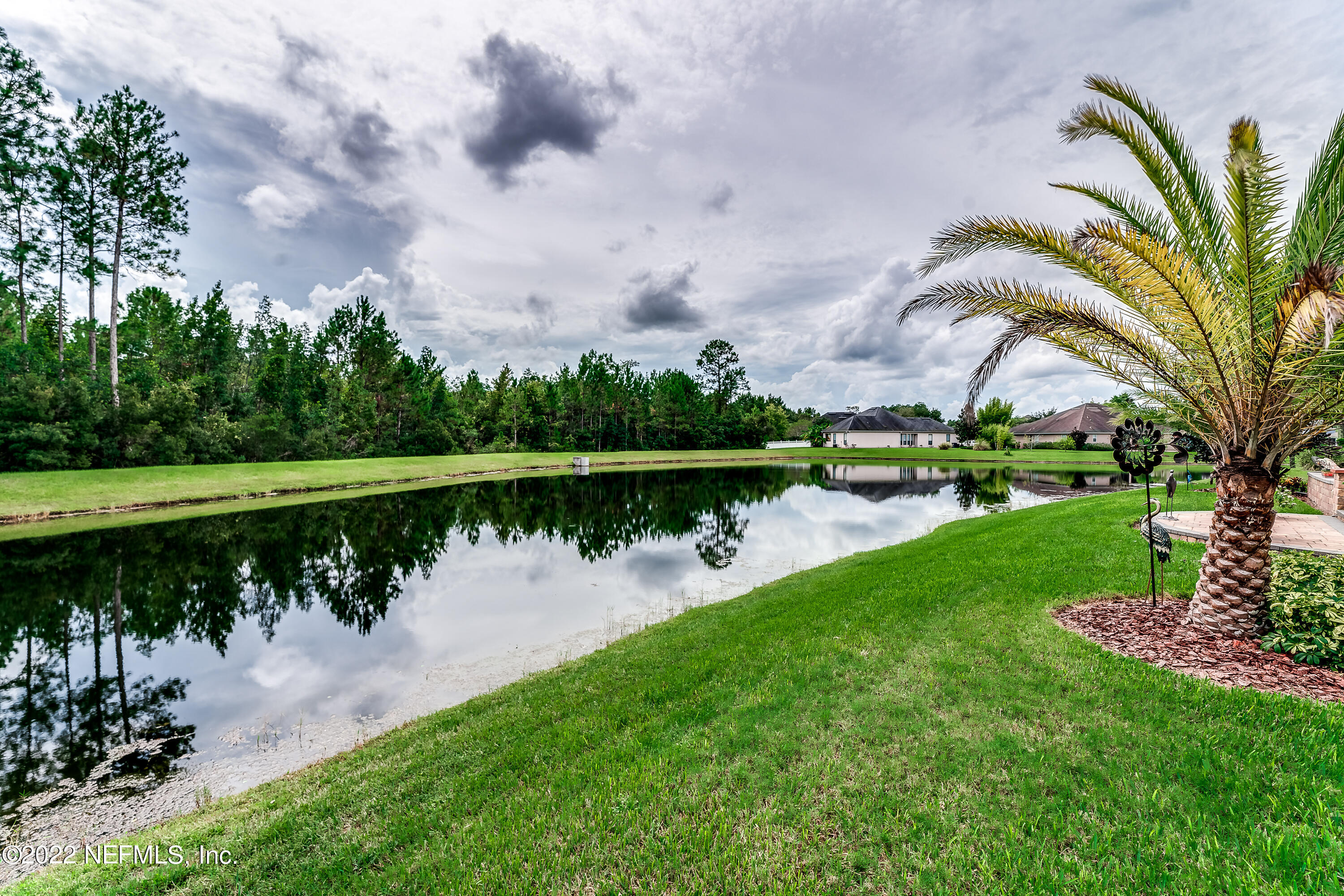 571 Saddlestone Drive Jacksonville, FL 32259 - Photo 64 of 65 a view of a lake with a park