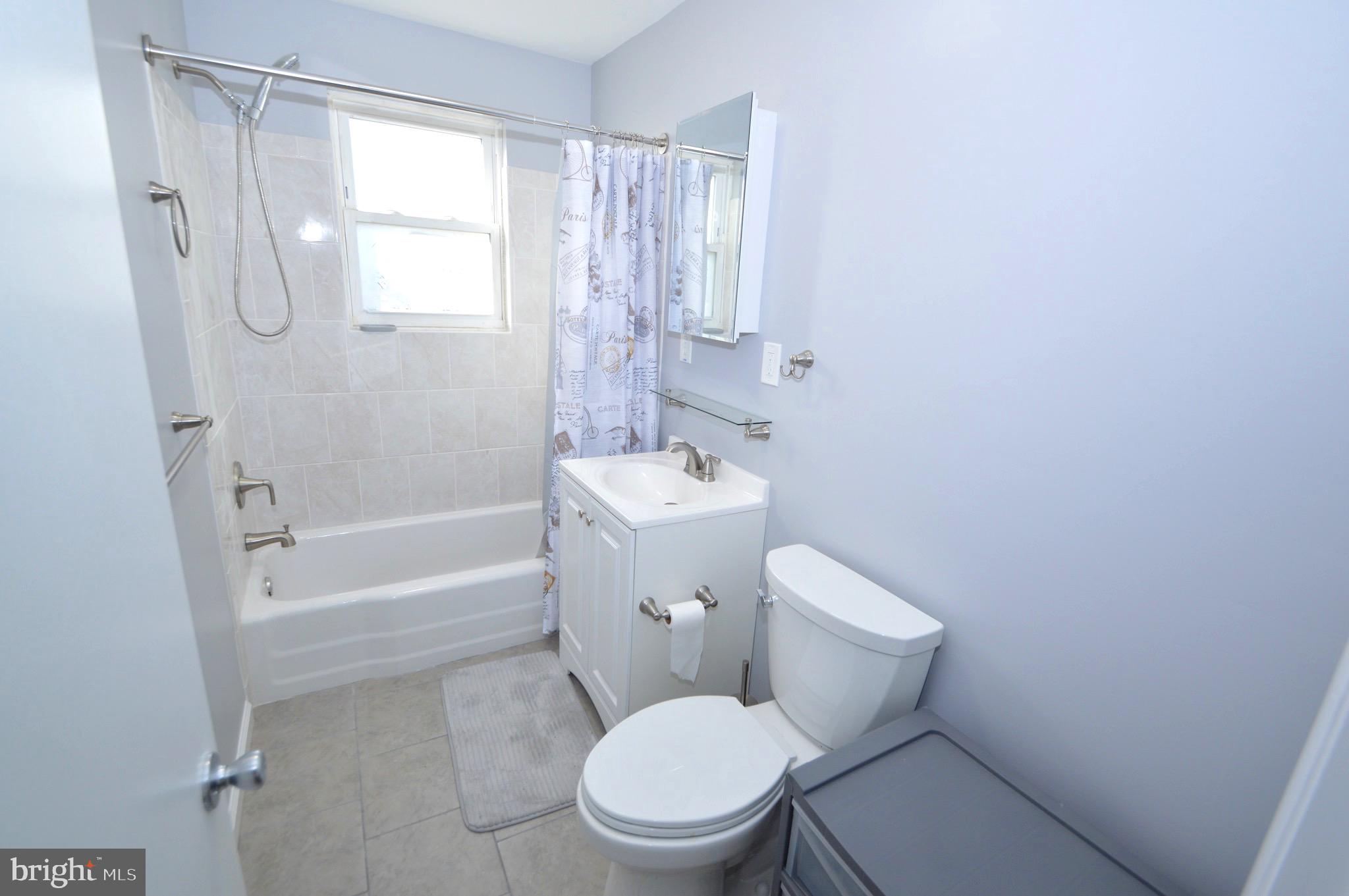 267 Mott Avenue Burlington, NJ 08016 - Photo 16 of 18 a white toilet sitting next to a bath tub shower