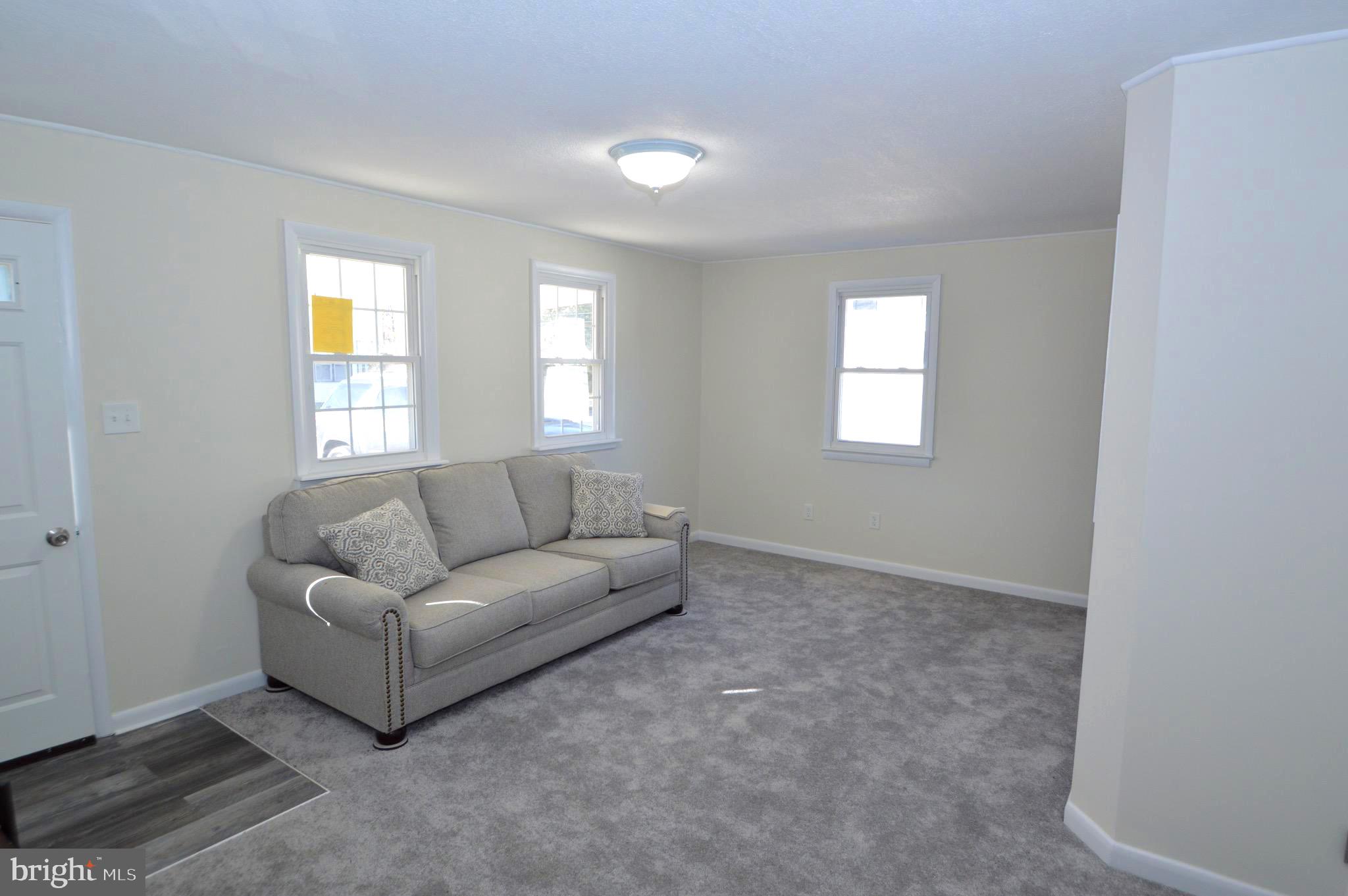 267 Mott Avenue Burlington, NJ 08016 - Photo 3 of 18 a living room with furniture and a window