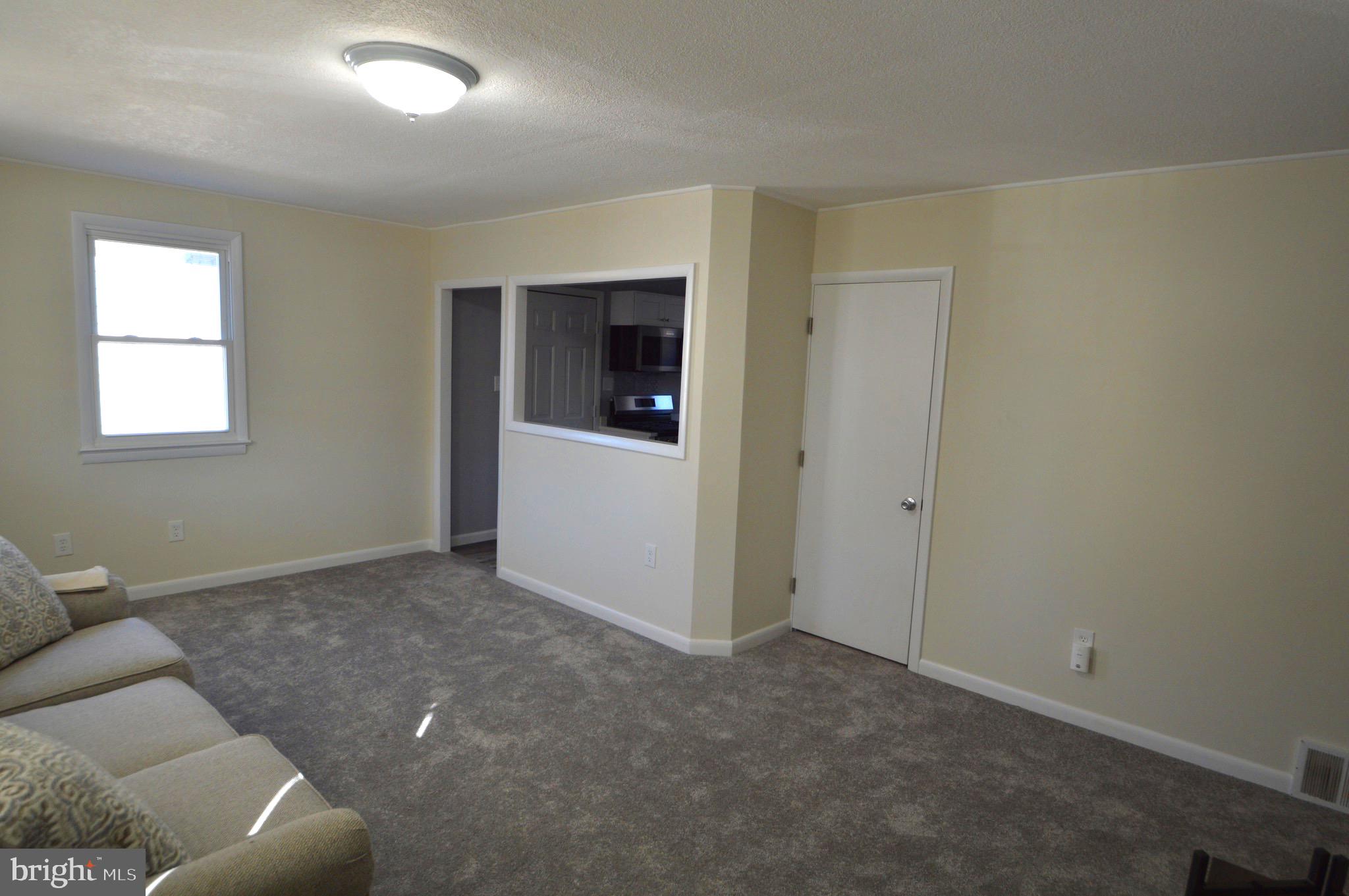 267 Mott Avenue Burlington, NJ 08016 - Photo 5 of 18 an empty room with windows