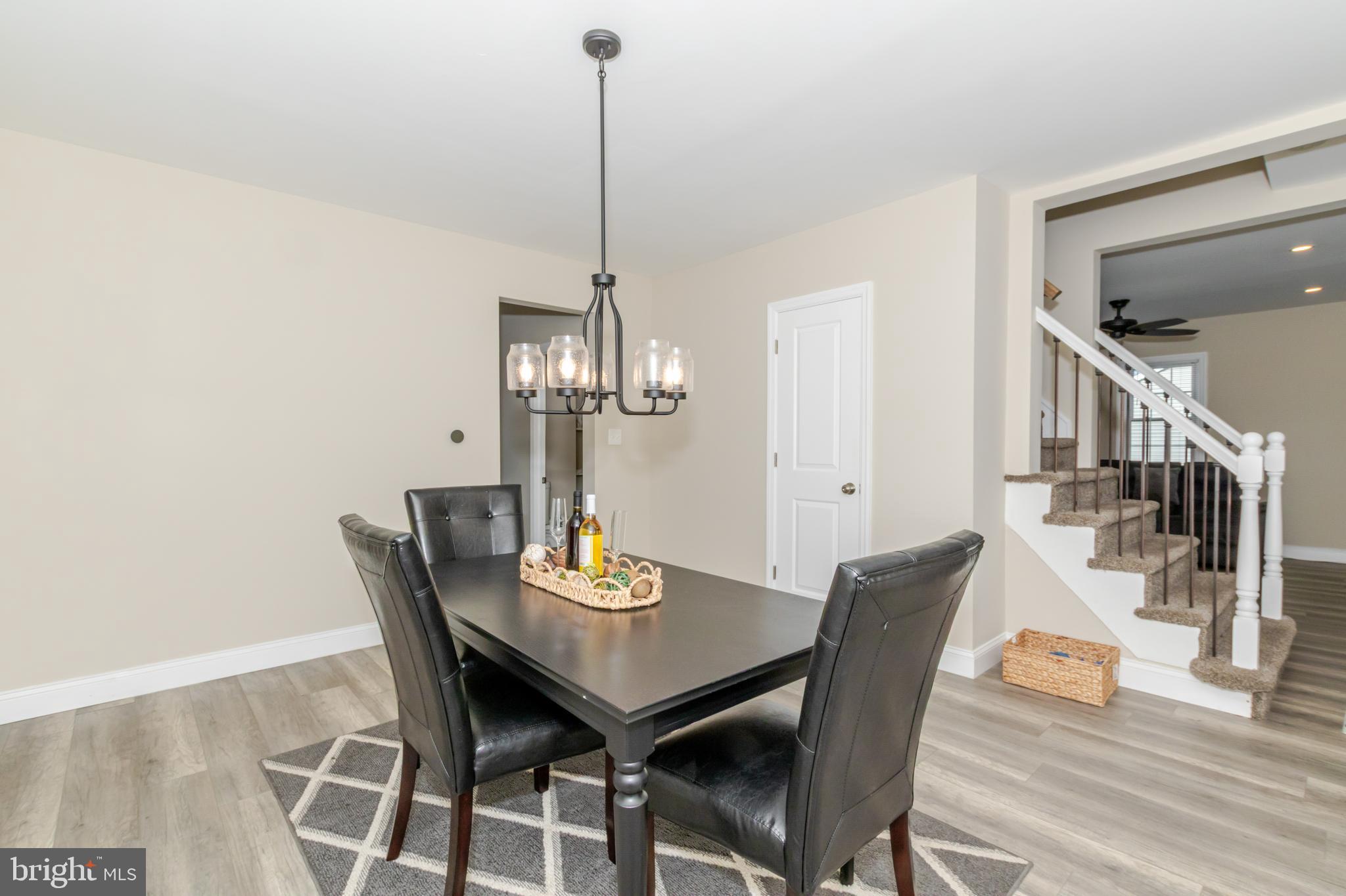 100 North 1st Road Hammonton, NJ 08037 - Photo 13 of 47 a view of a dining room with furniture wooden floor and chandelier