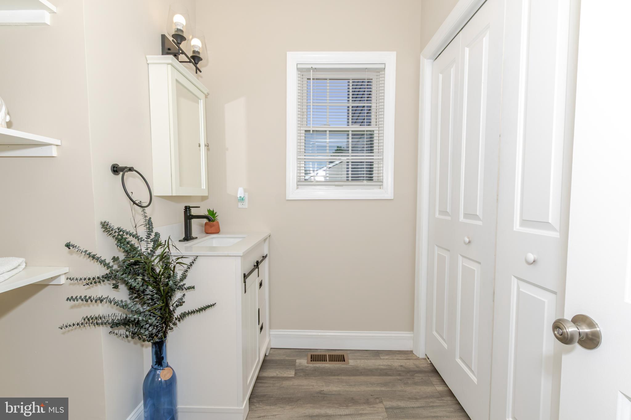100 North 1st Road Hammonton, NJ 08037 - Photo 21 of 47 a view of a hallway with windows and flower pot