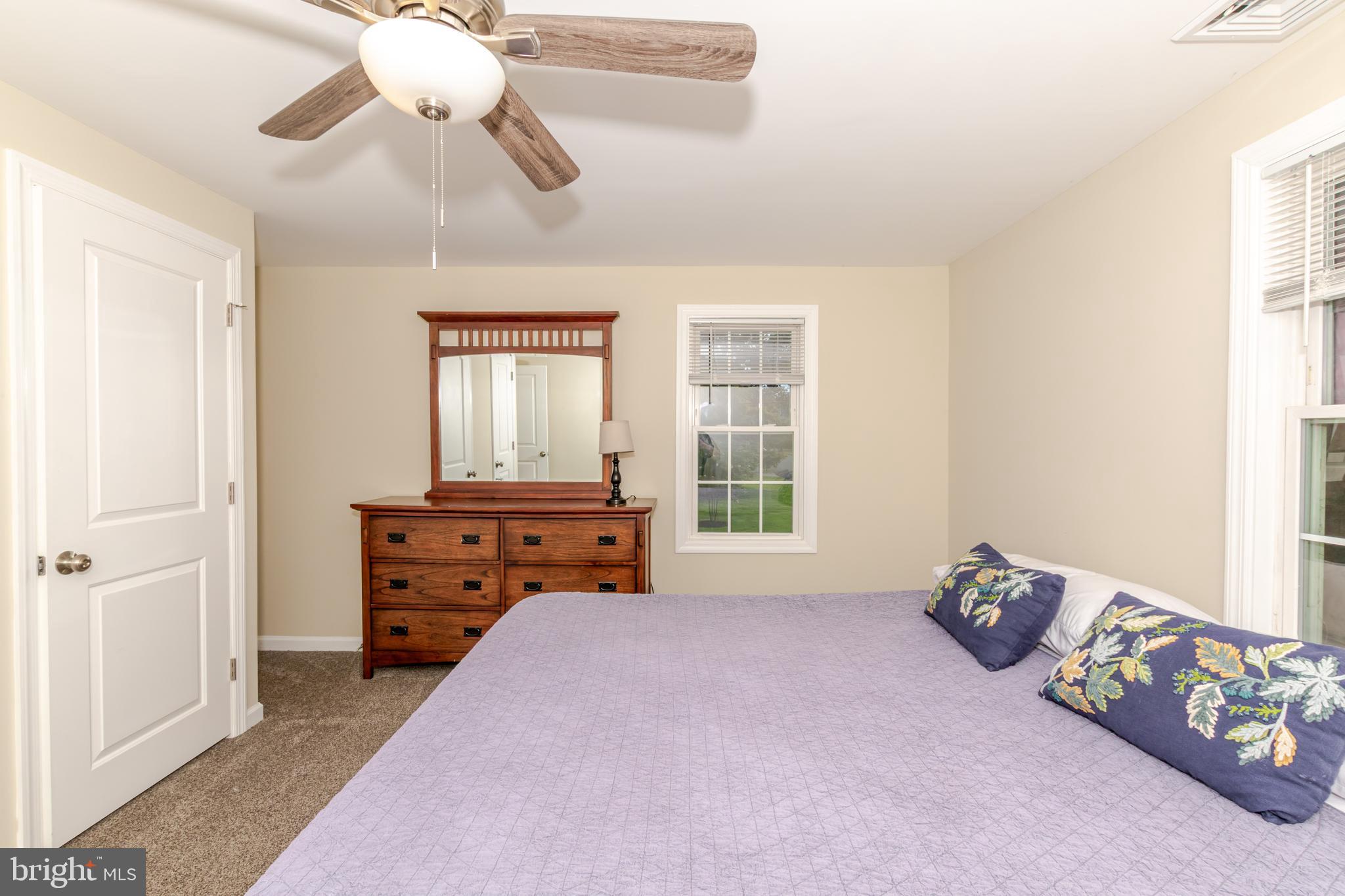 100 North 1st Road Hammonton, NJ 08037 - Photo 23 of 47 a bedroom with a bed and a chandelier