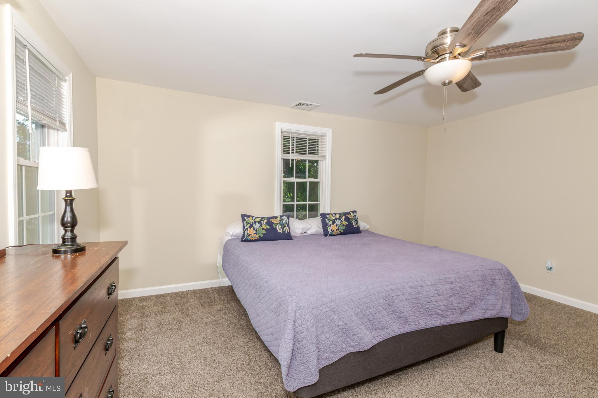 100 North 1st Road Hammonton, NJ 08037 - Photo 25 of 47 a bedroom with a bed and a chandelier