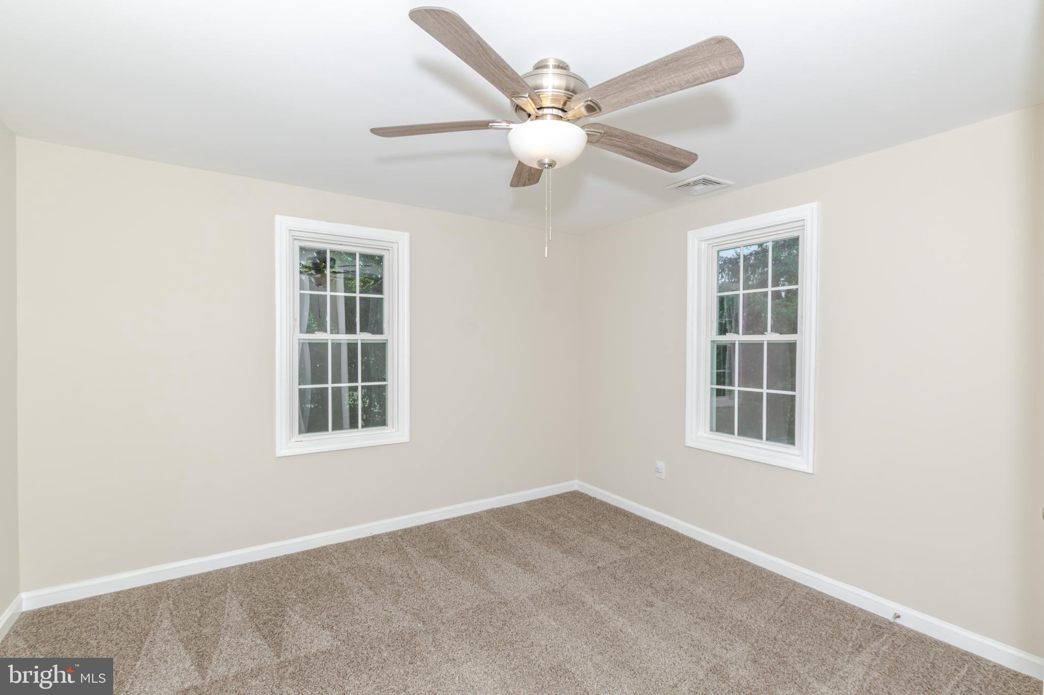 100 North 1st Road Hammonton, NJ 08037 - Photo 29 of 47 an empty room with windows and ceiling fan