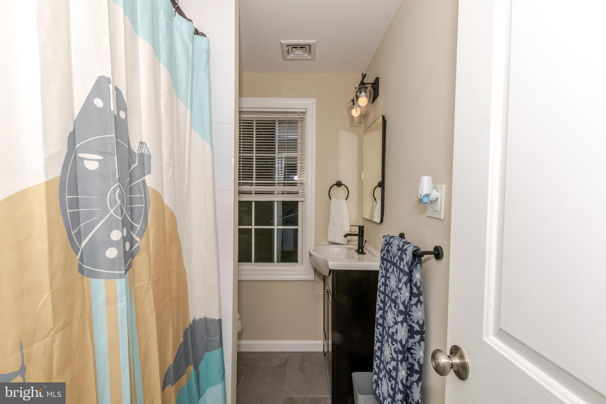 100 North 1st Road Hammonton, NJ 08037 - Photo 40 of 47 a bathroom with a sink and mirror with shower
